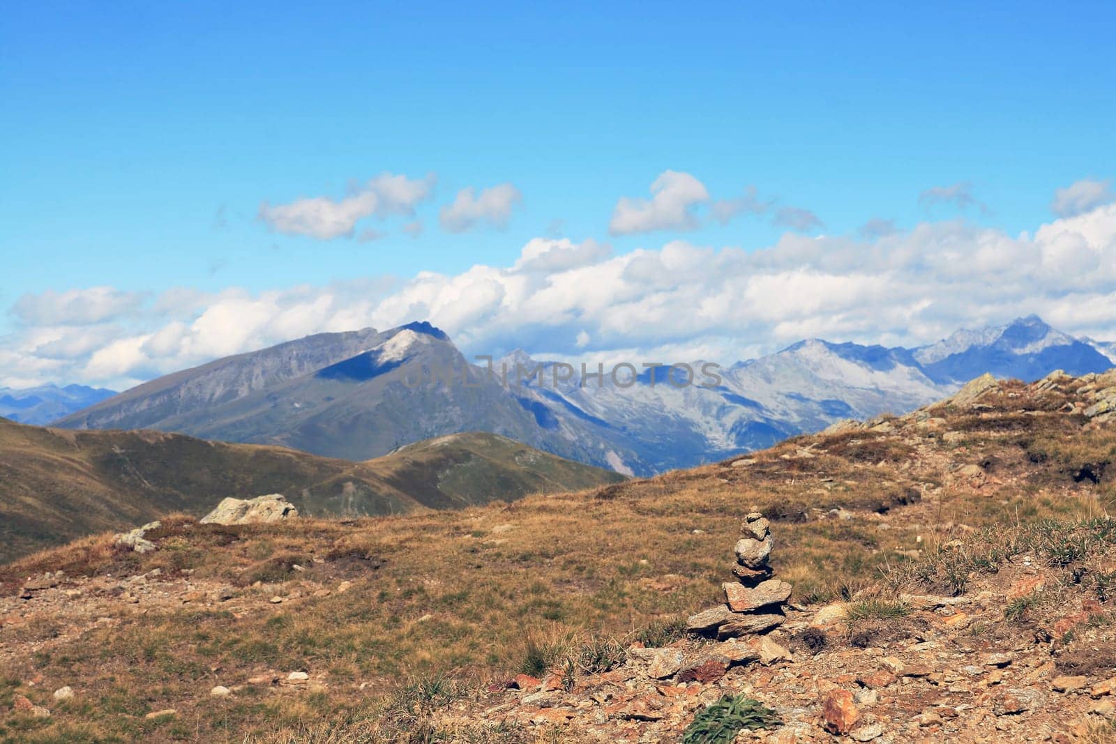 South Tyrol - A small stone tower in front of a large backdrop