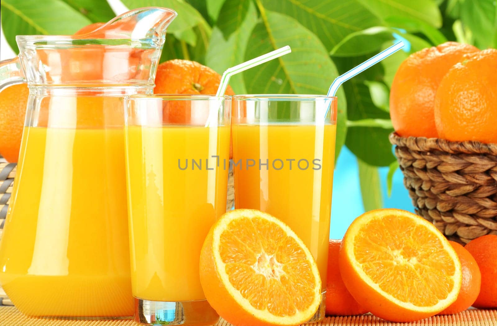 Composition with two glasses of orange juice and fruits