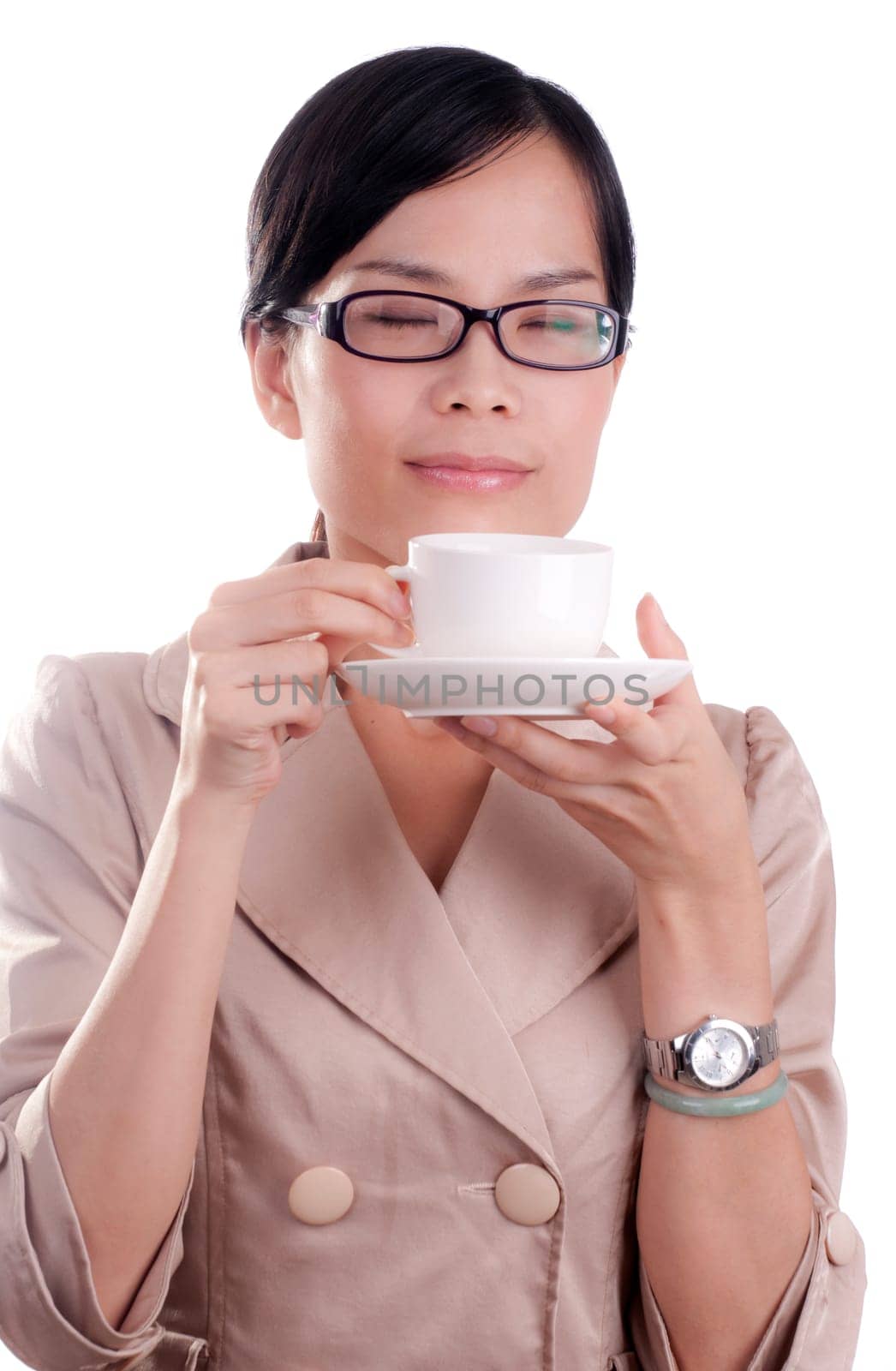 Asian business woman about to enjoy her morning cup of coffee before work isolated