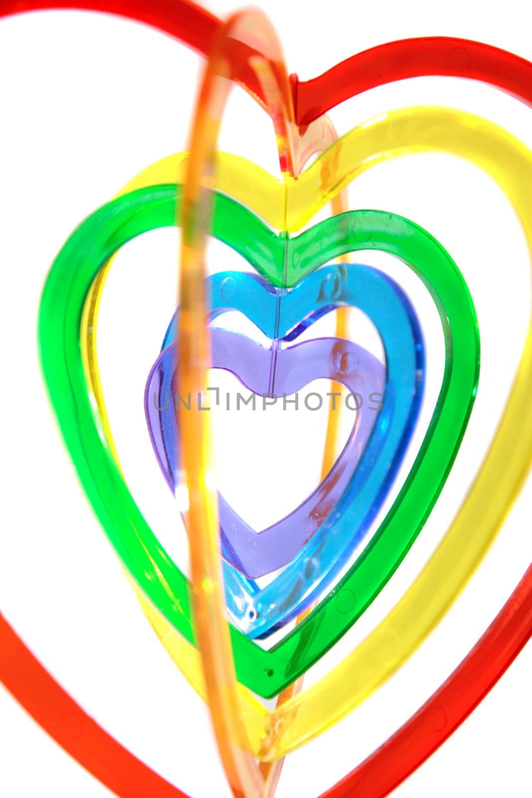 six heart shaped plastic pieces one inside the other on a white background