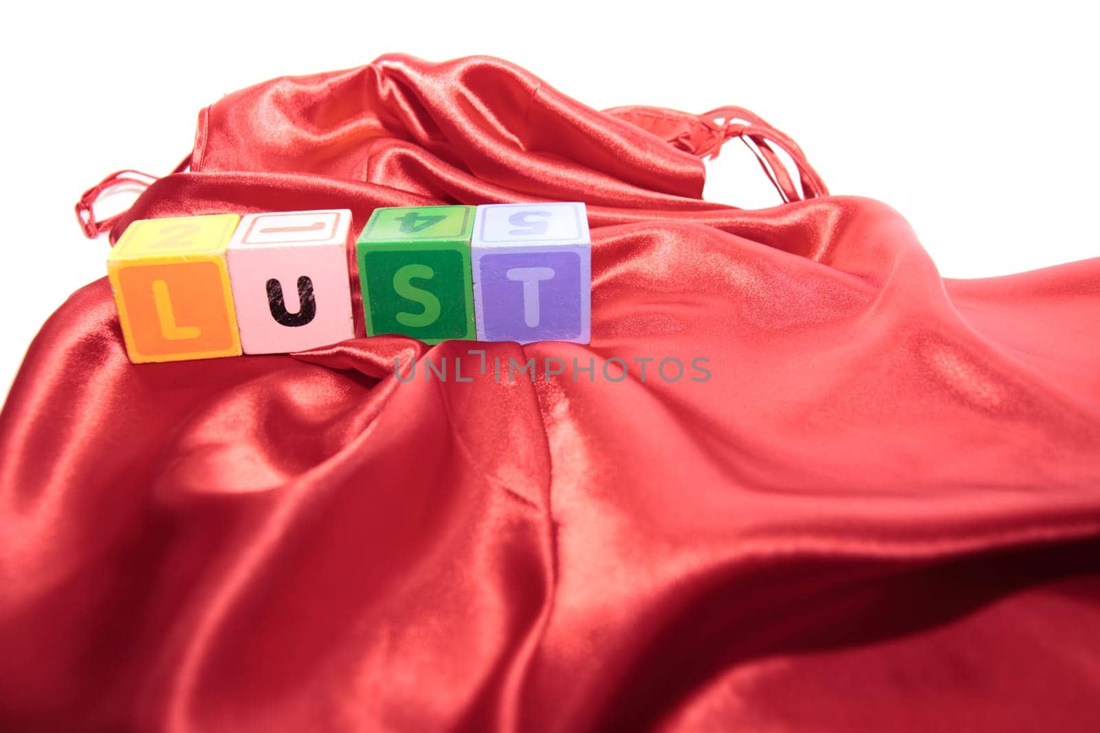 lust written with blocks on a silk nightie
