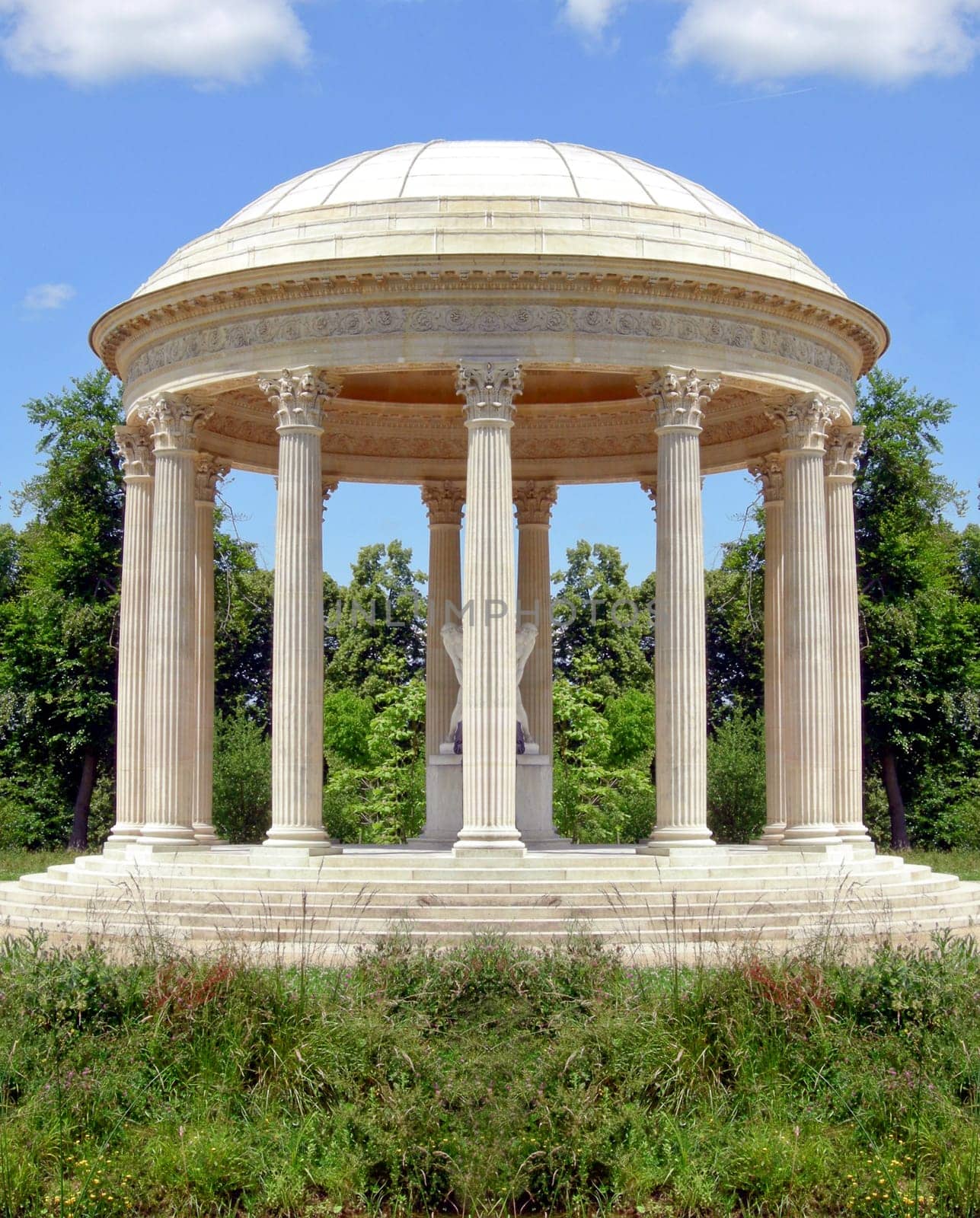 Classical circular temple in a garden