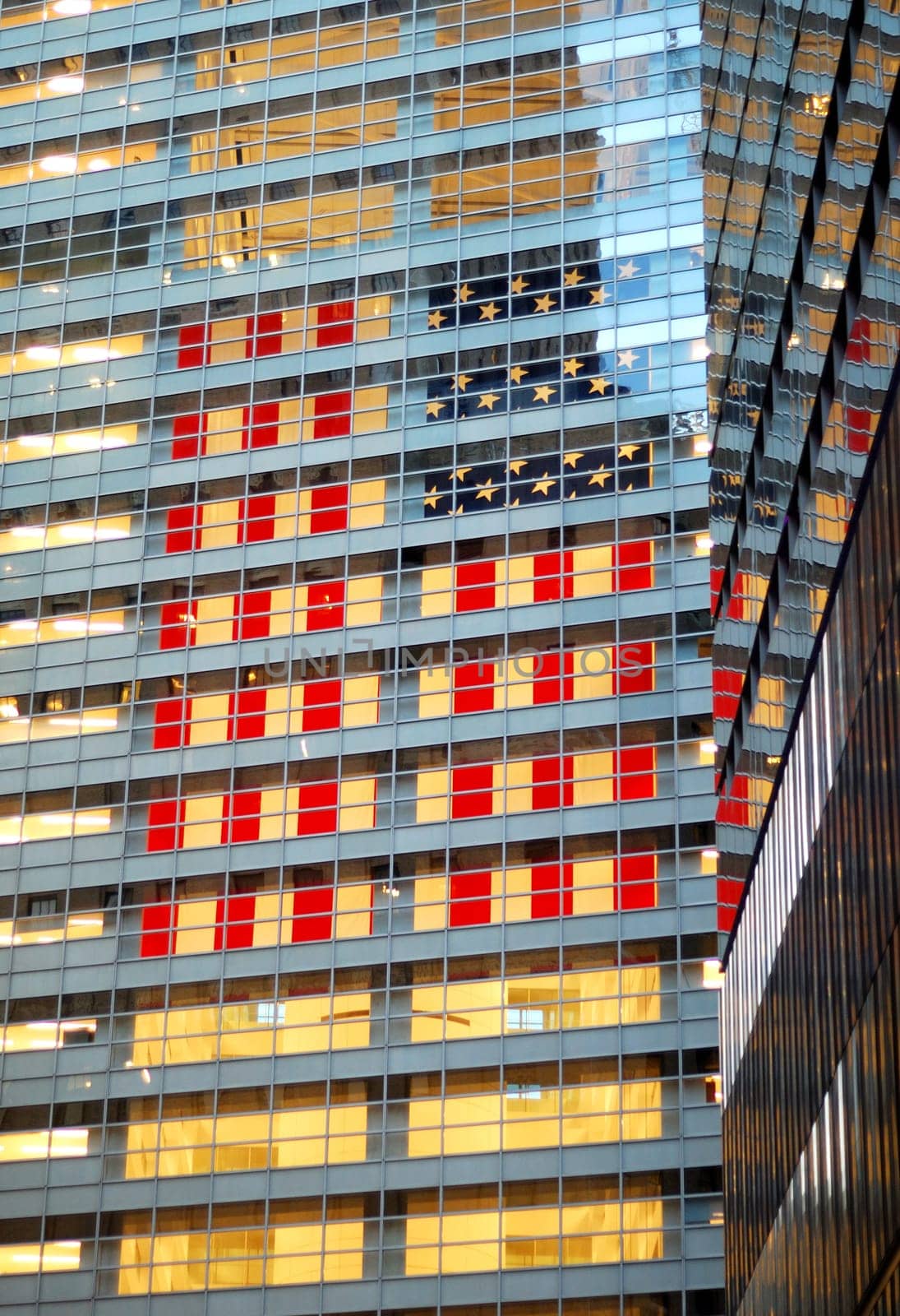 A giant American flag hanging inside a commercial building
