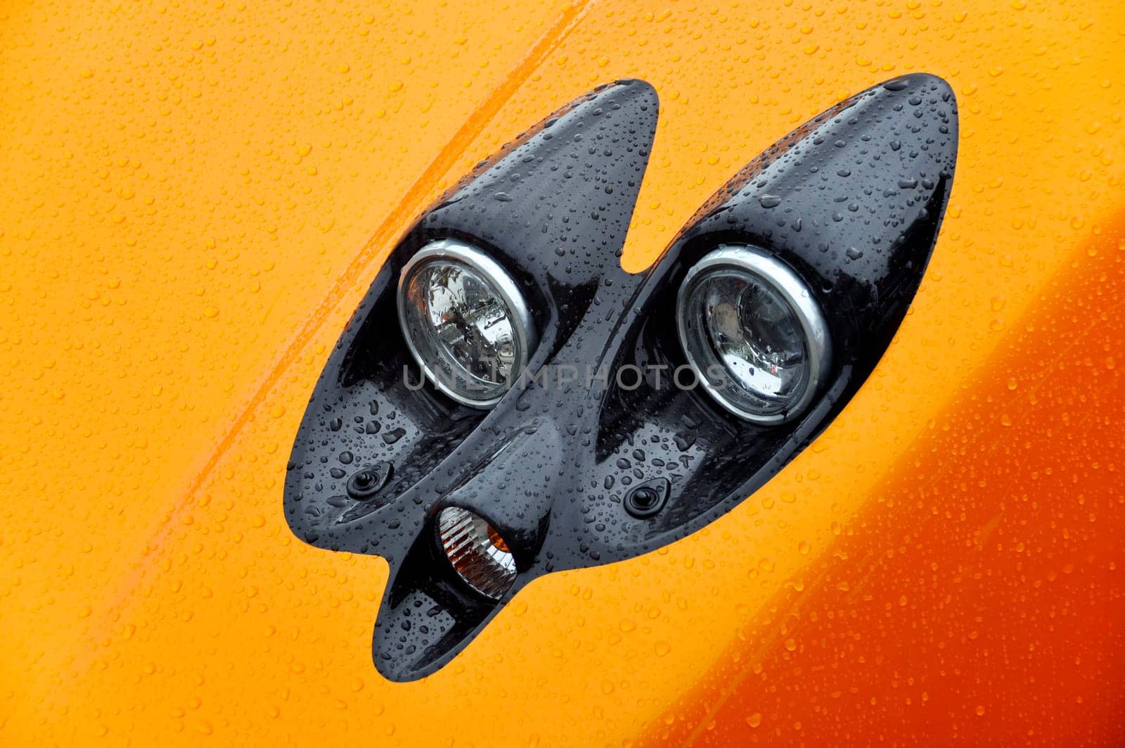 Headlight of an orange Italian supercar, Pagani Zonda F