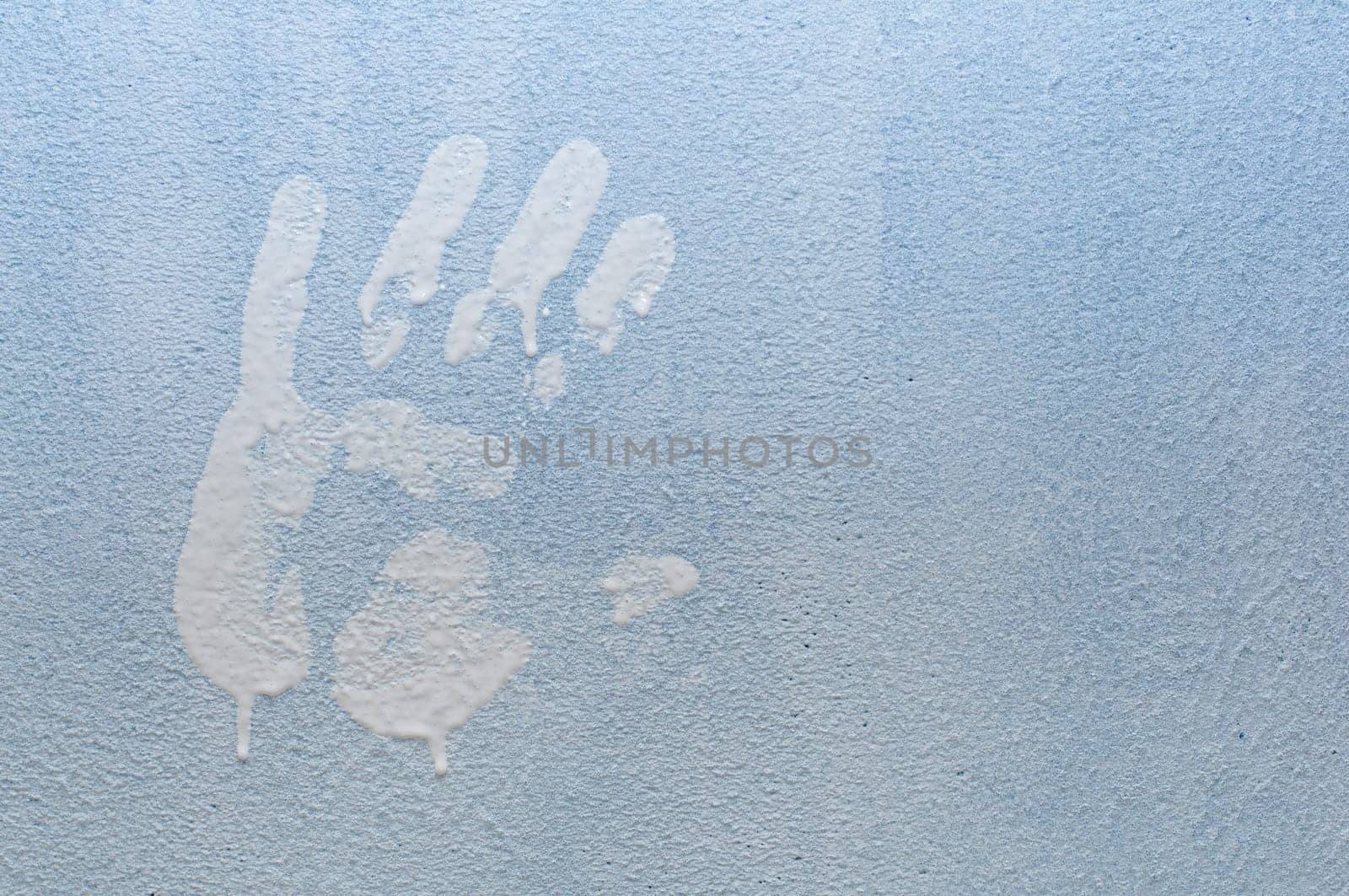 White Hand Print on Light Blue Wall