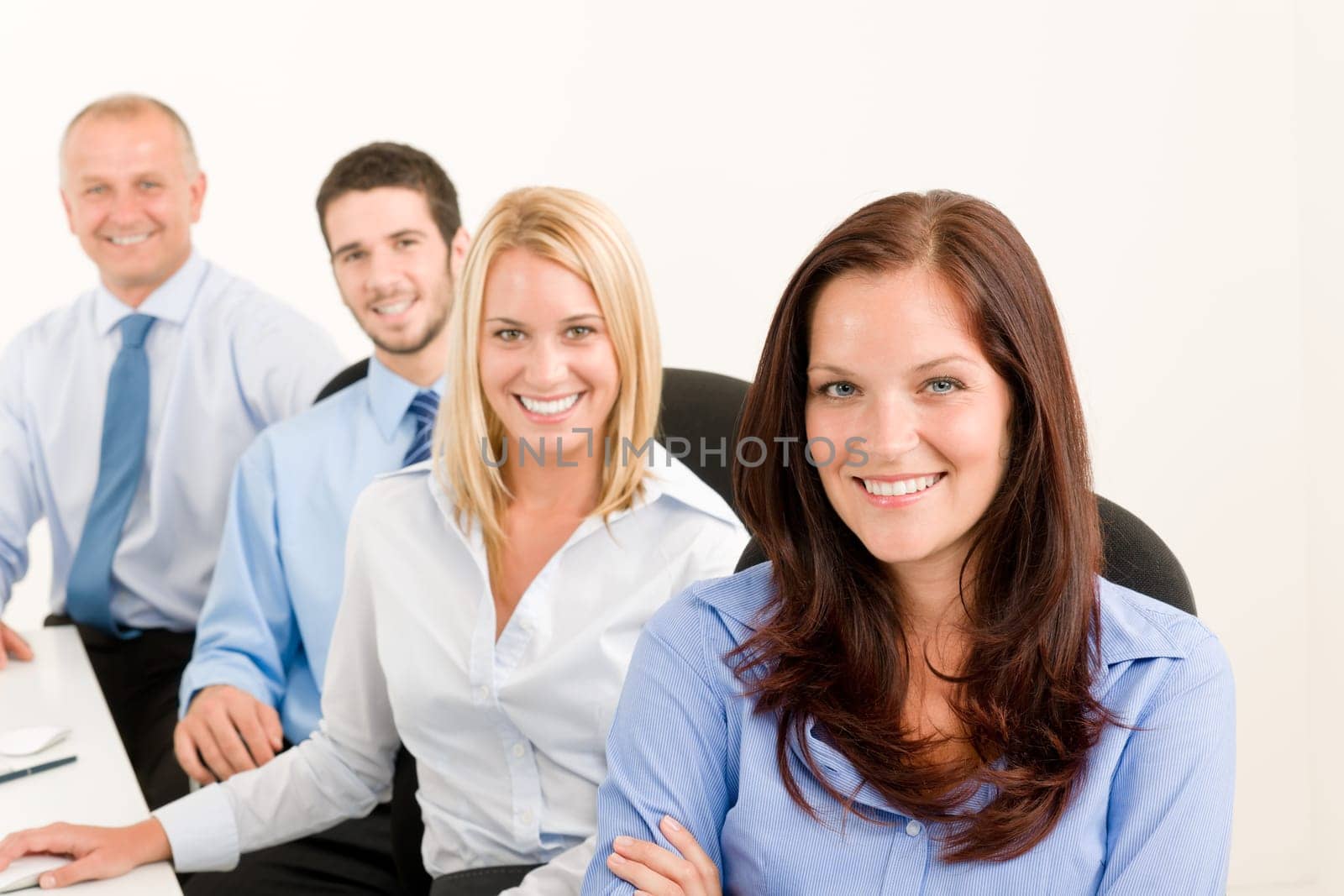 Business team attractive woman sit in line behind computer table