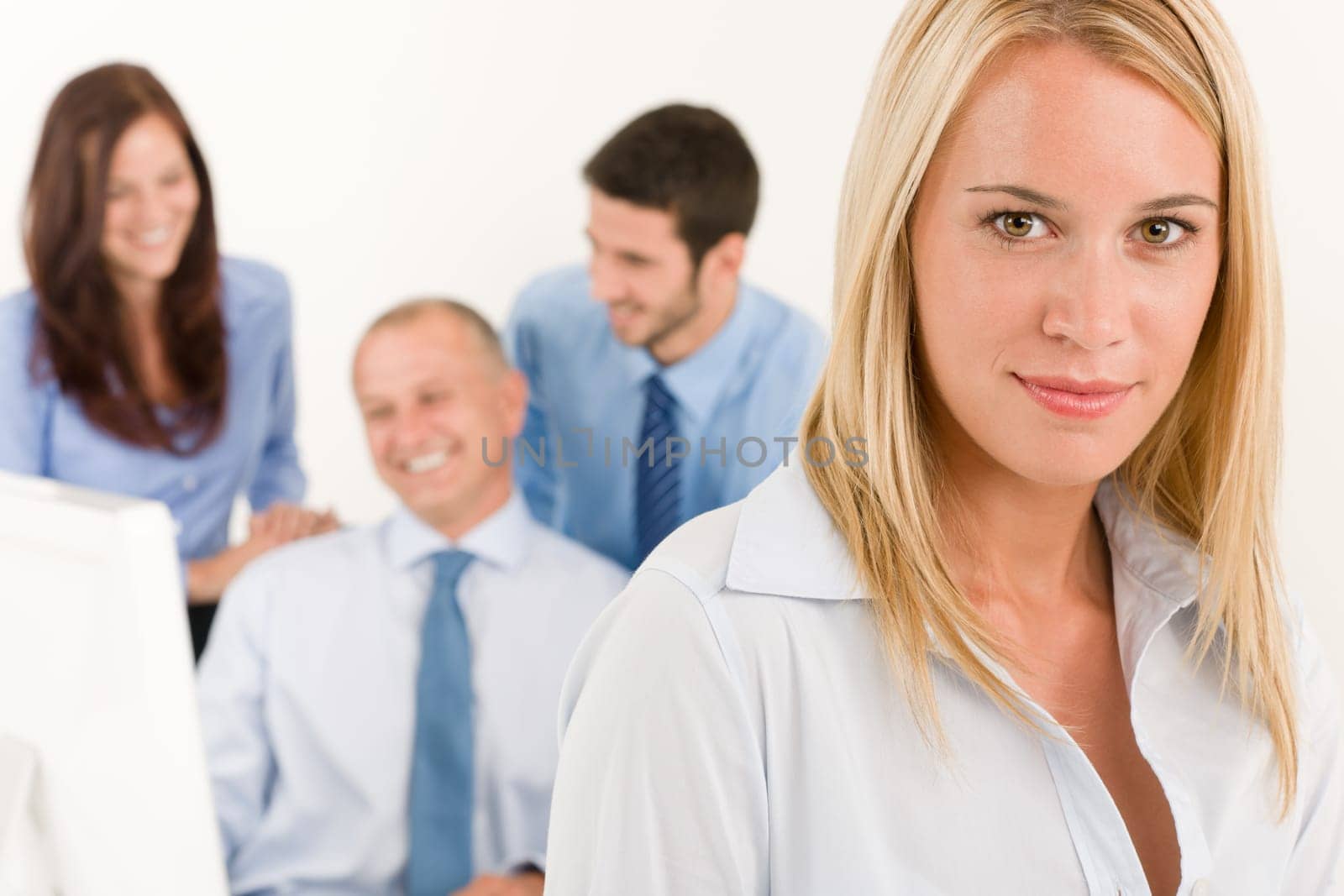 Business team close-up of pretty businesswoman with attractive happy colleagues