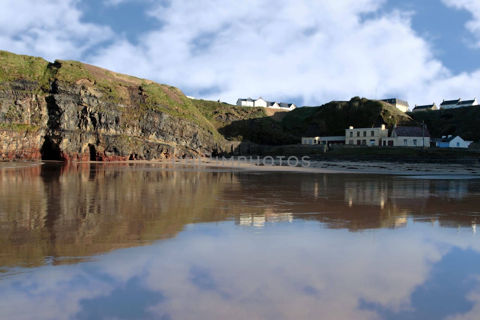 beautiful view of a quiet ballybunion beach and cliffs
