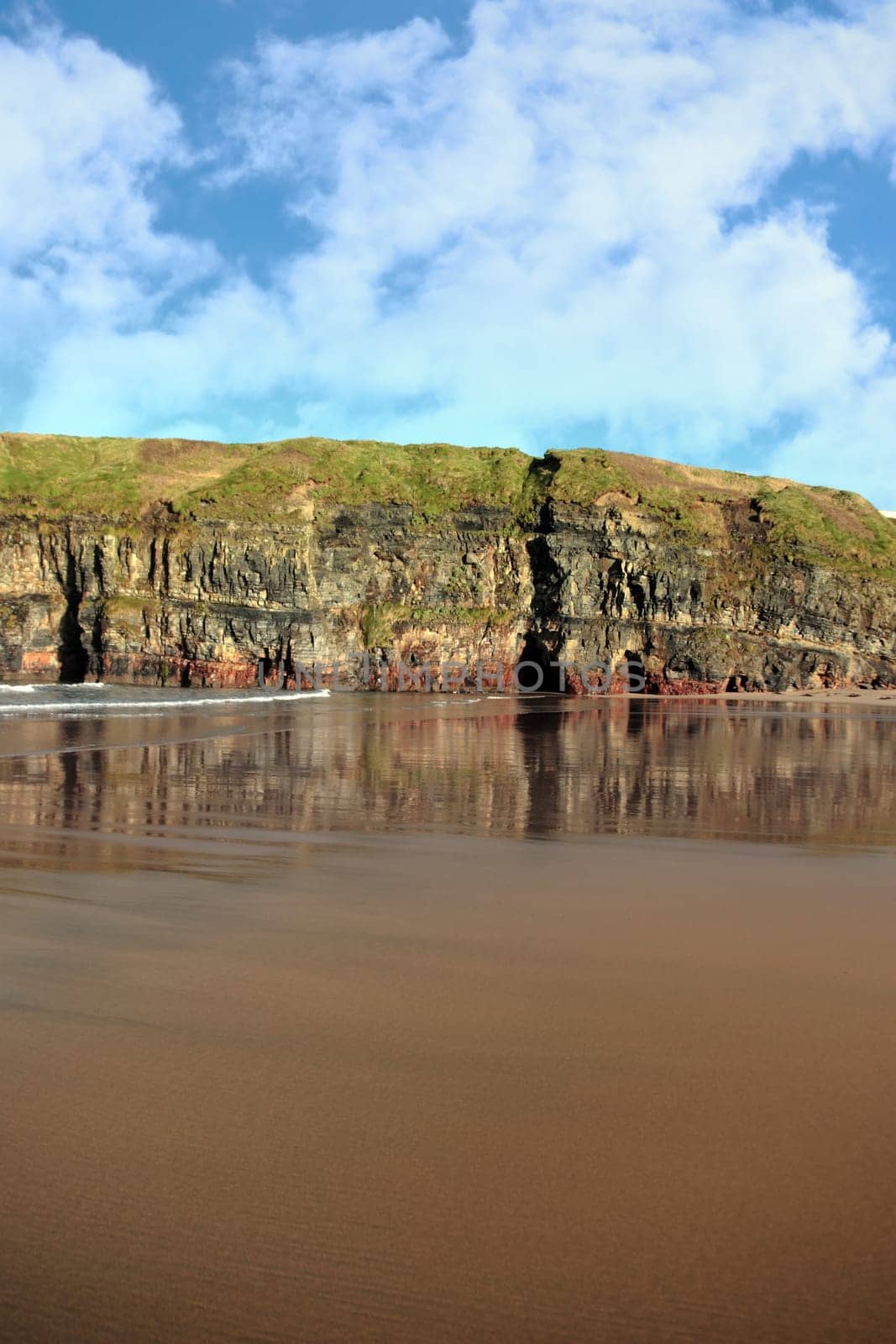 ballybunion beach in winter with the cliffs