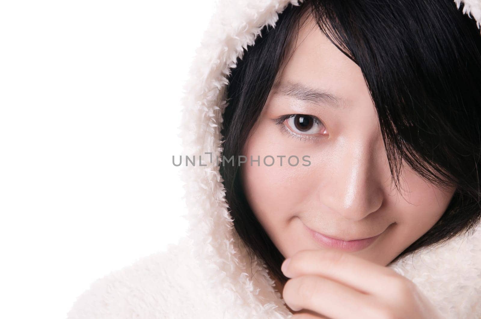 Beautiful young woman in winter outerwear on white