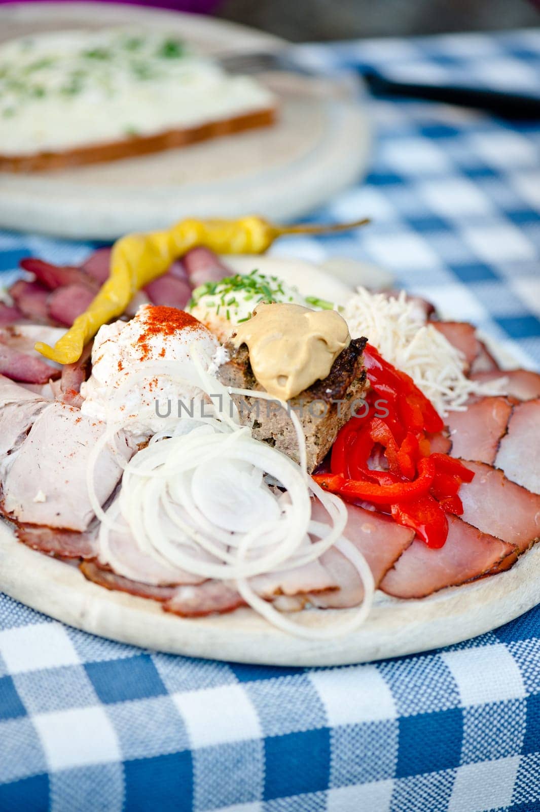 Austrian traditional plate of cold-cuts with self-made ingredient on wooden plate