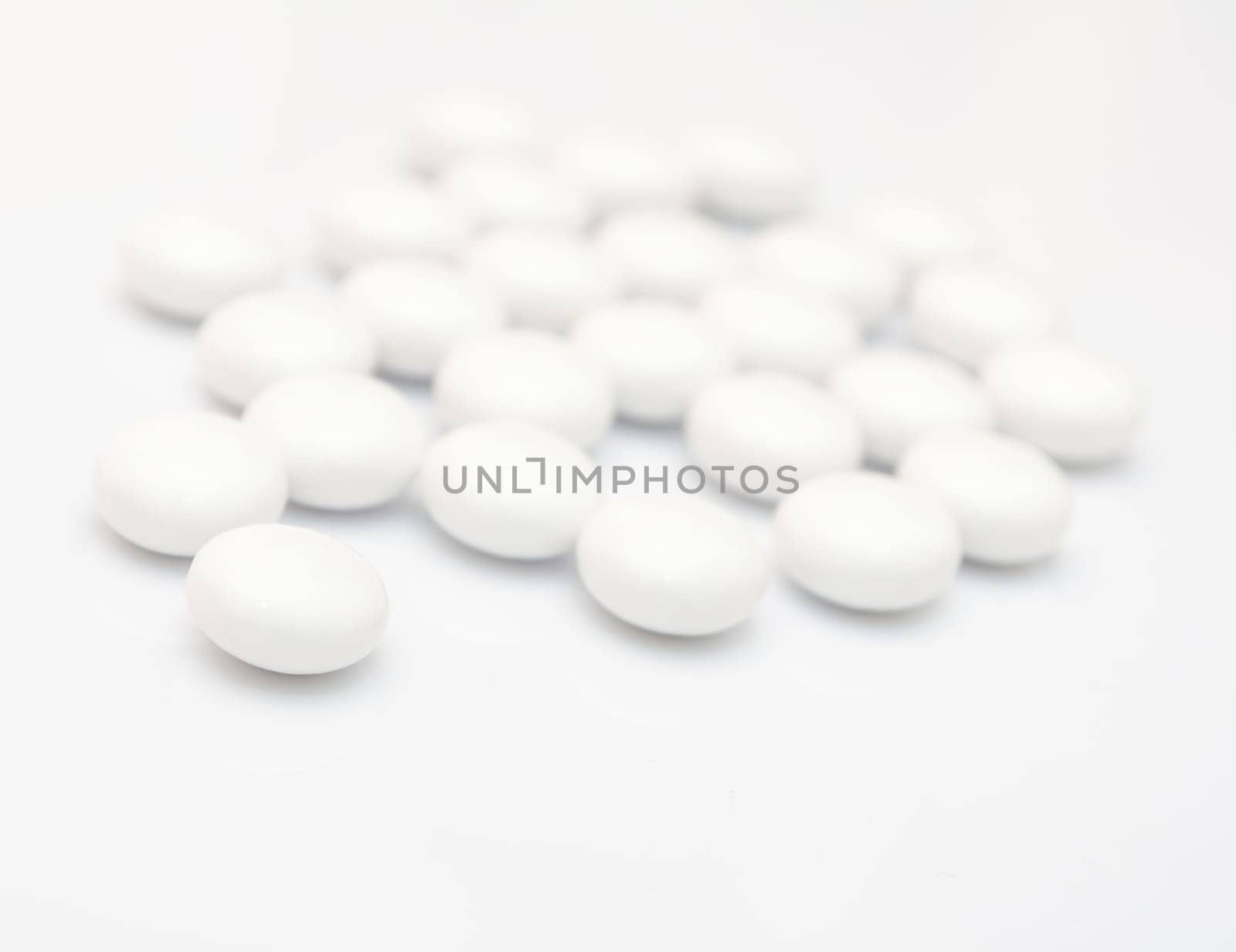 Many White Pills on White Background