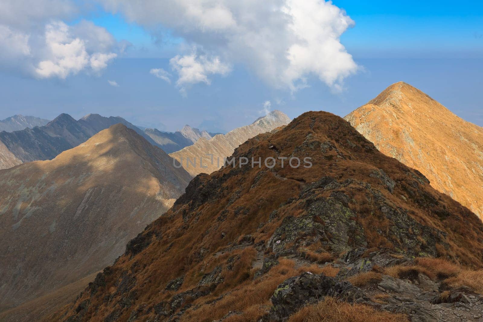 rows of mountains and a sky with clouds, Fagaras mountains, Romania