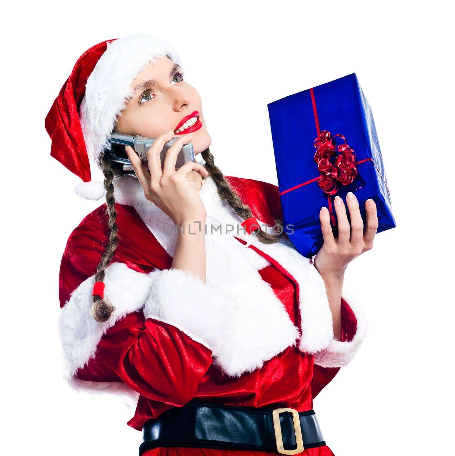 one woman dressed as santa claus holding christmas presents gifts on the telephone studio isolated white background