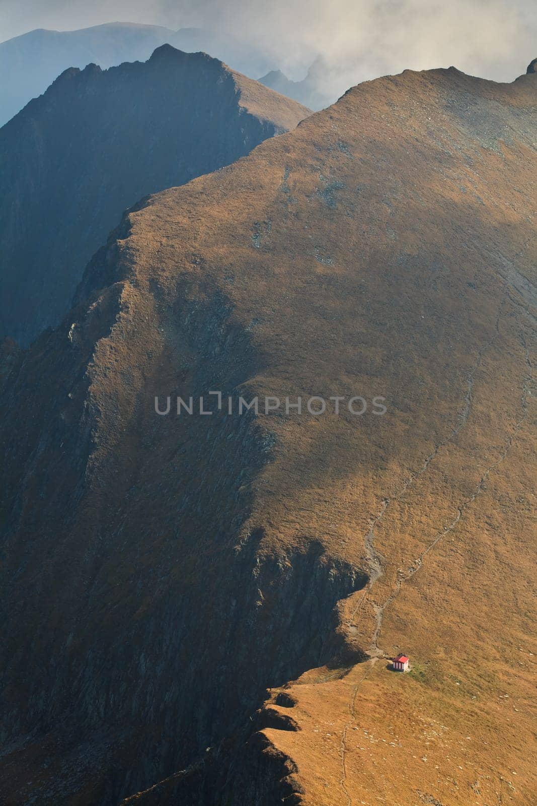 a red refuge on a mountain top