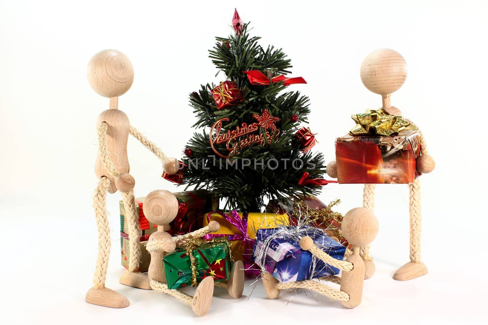 a doll family under the Christmas tree