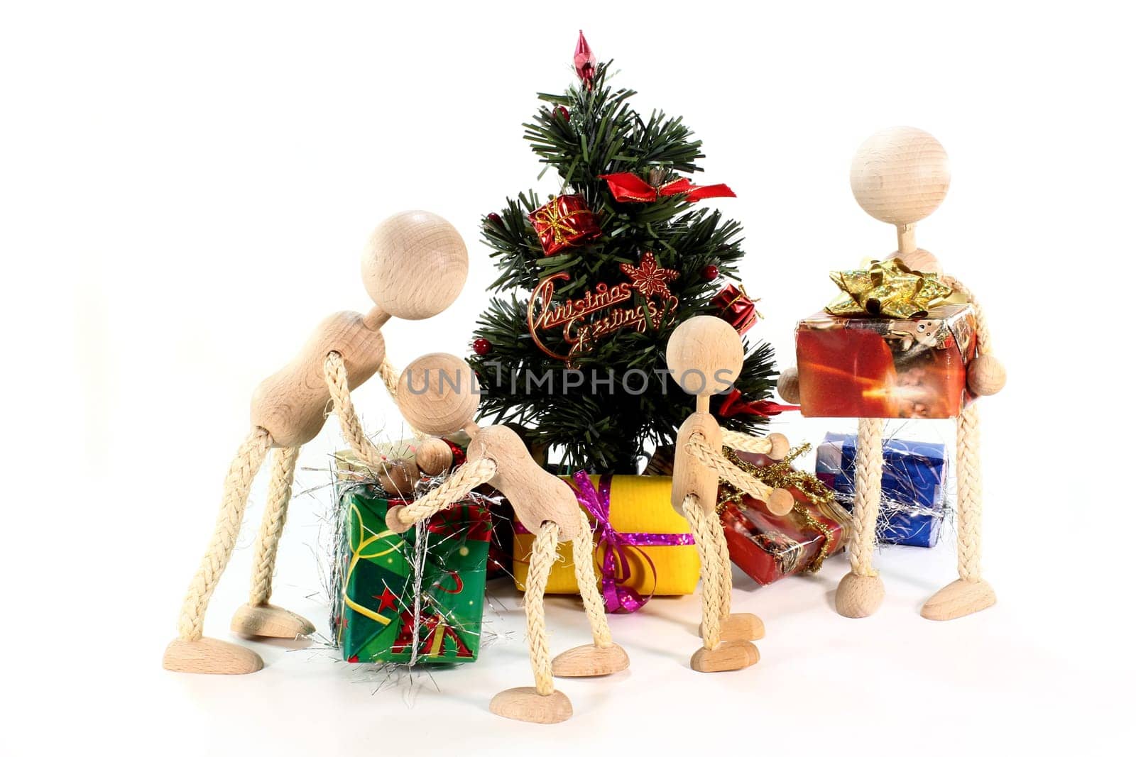 a doll family under the Christmas tree