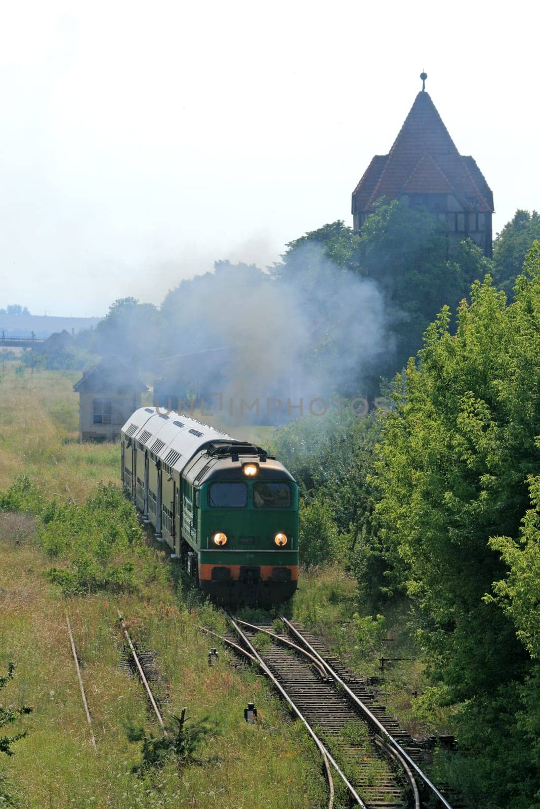 Passenger train departing from the abandoned station