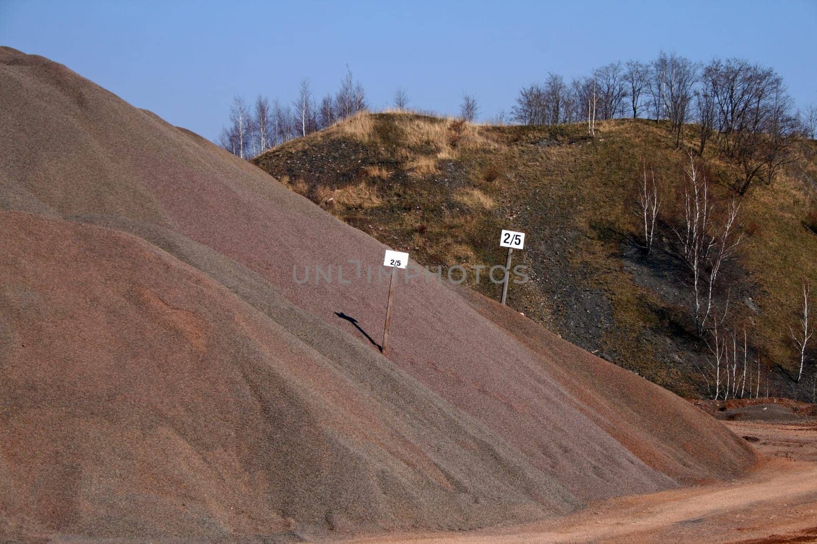 Ballast hill with wooden signs
