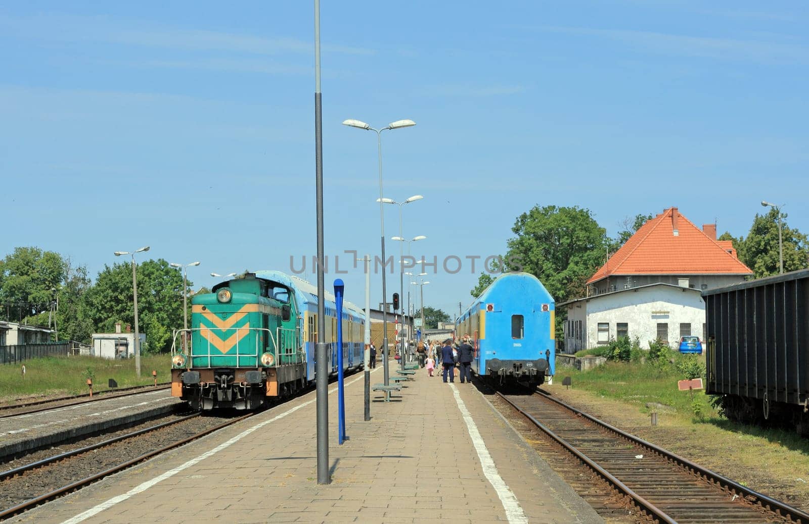 Two trains in opposite directions stopped at the small station