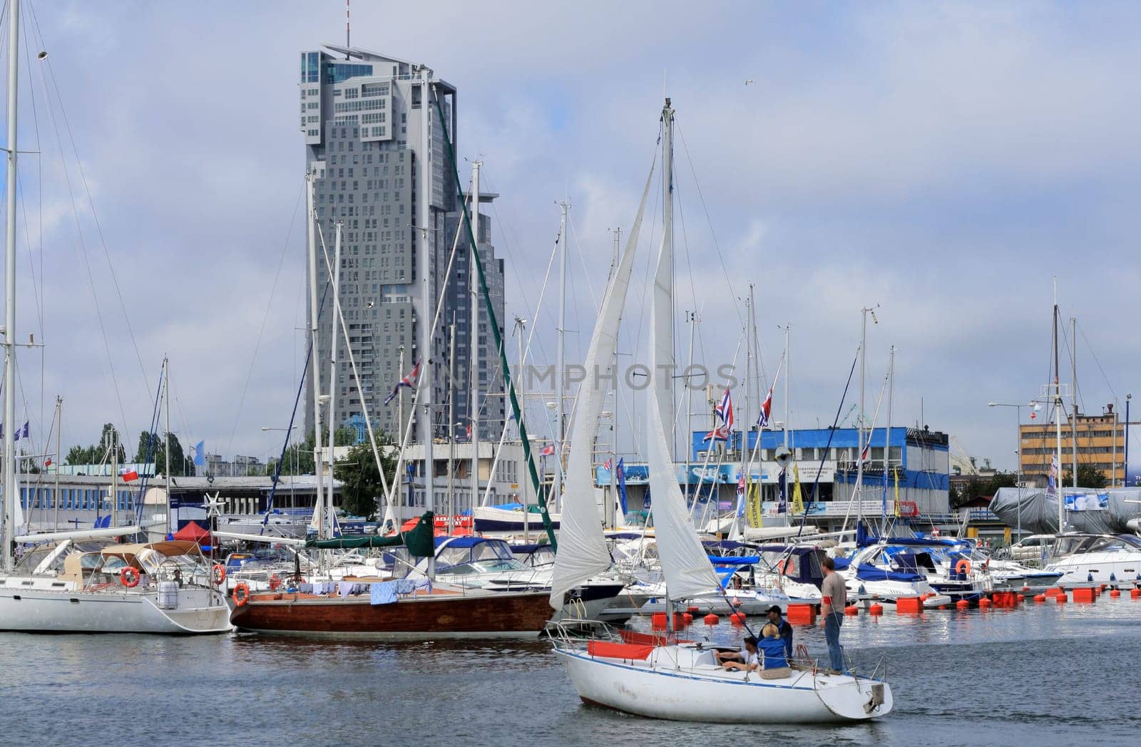 Sailboat entering the marina in gdynia, poland