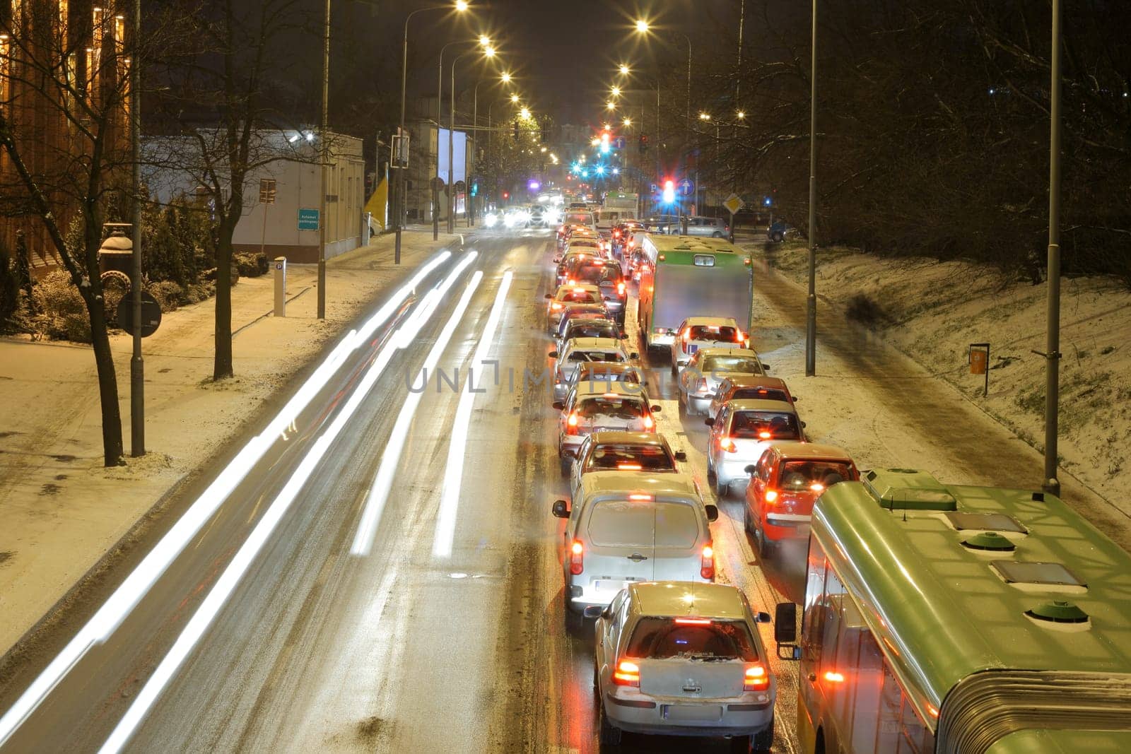 Rush hour traffic lined up car by car on the downtown streets during the evening