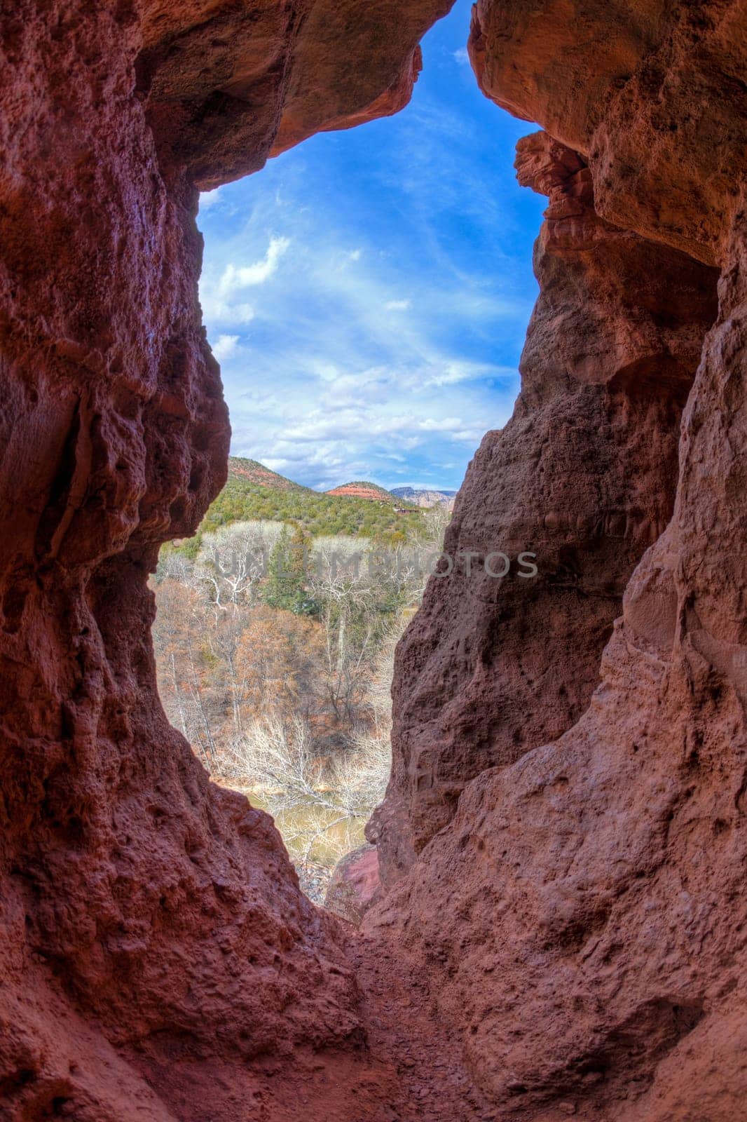 Opening in a red rock cliff face in Sedona, Arizona