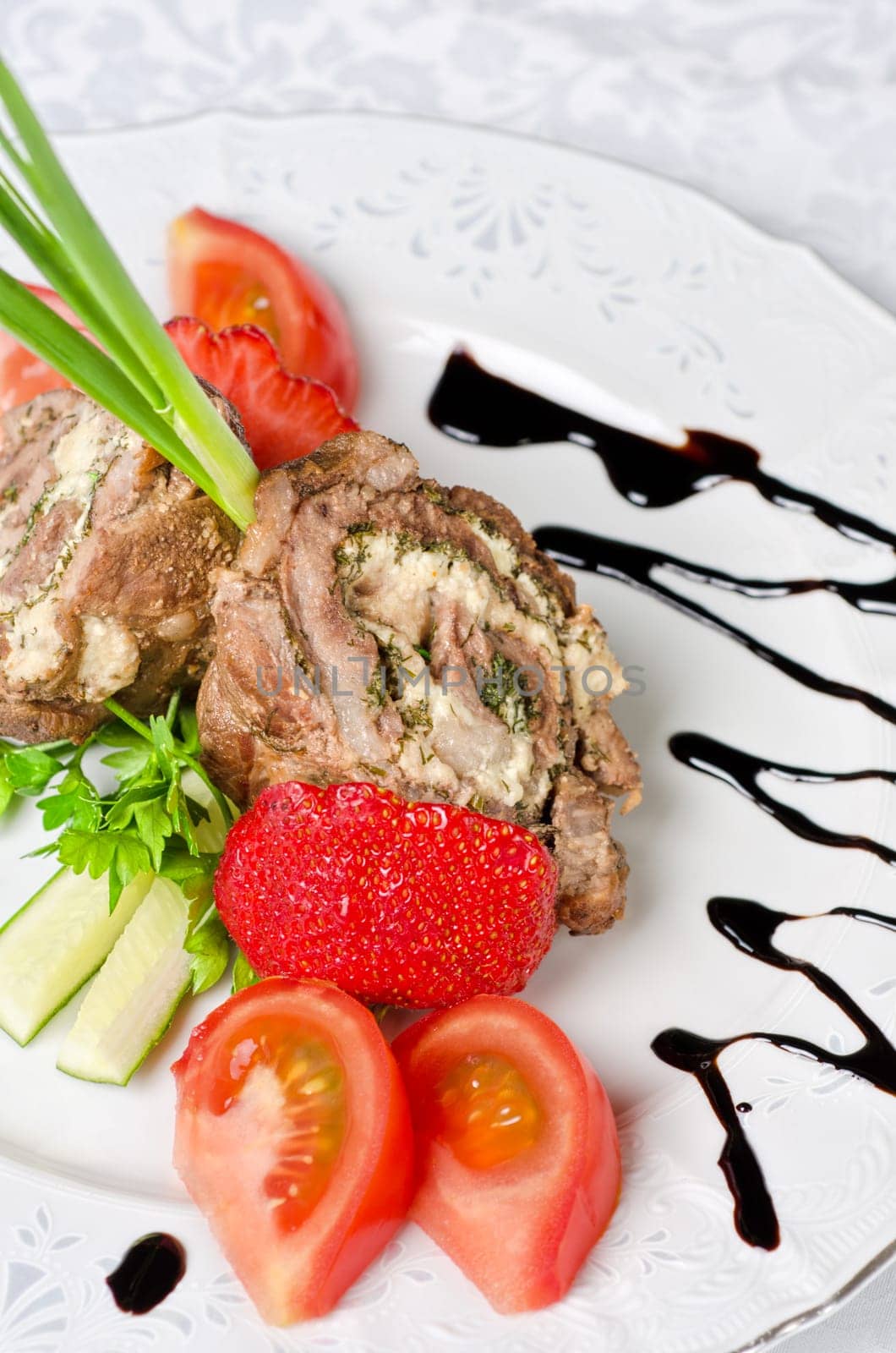 Pork rolls with cheese and vegetables: onion, cucumbers, tomatoes