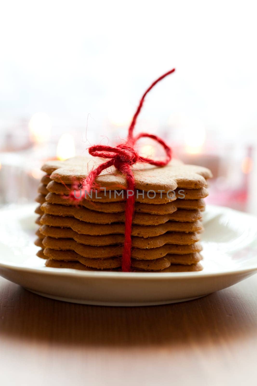 Close-up of delicious Christmas gingerbread cookies with candles
