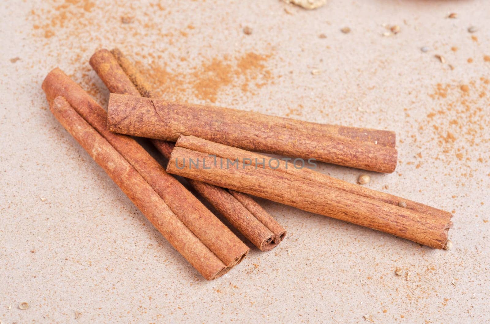 Cinnamon stick closeup on a brown background