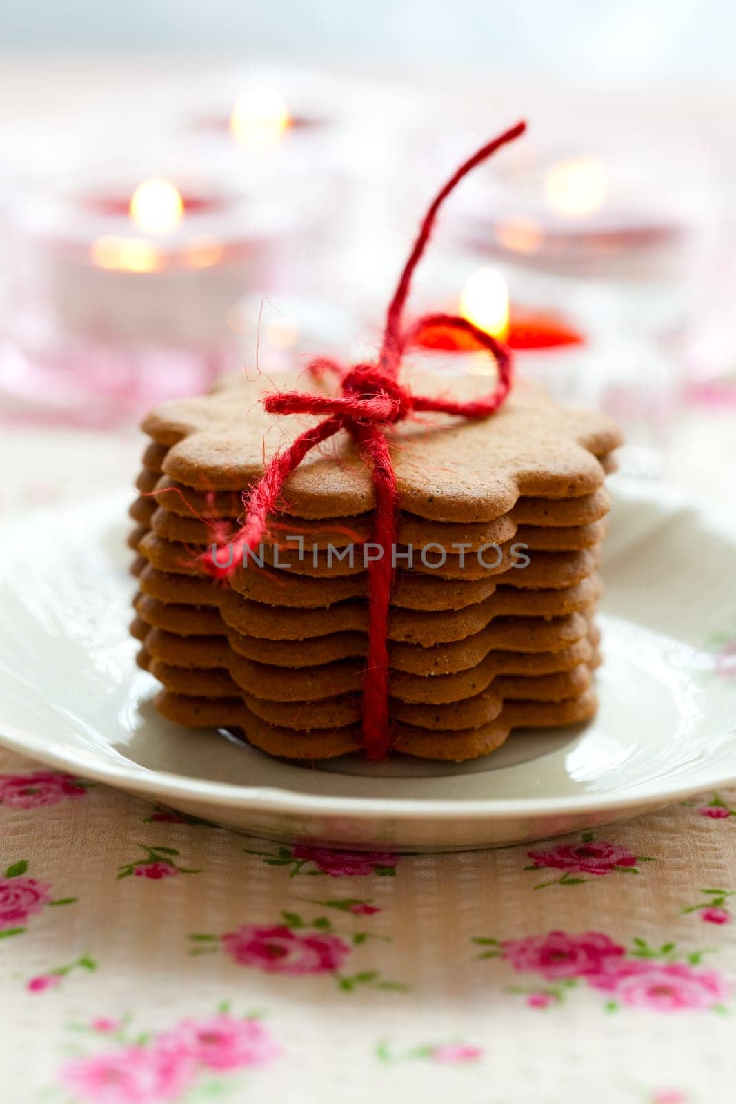 Close-up of delicious Christmas gingerbread cookies with candles