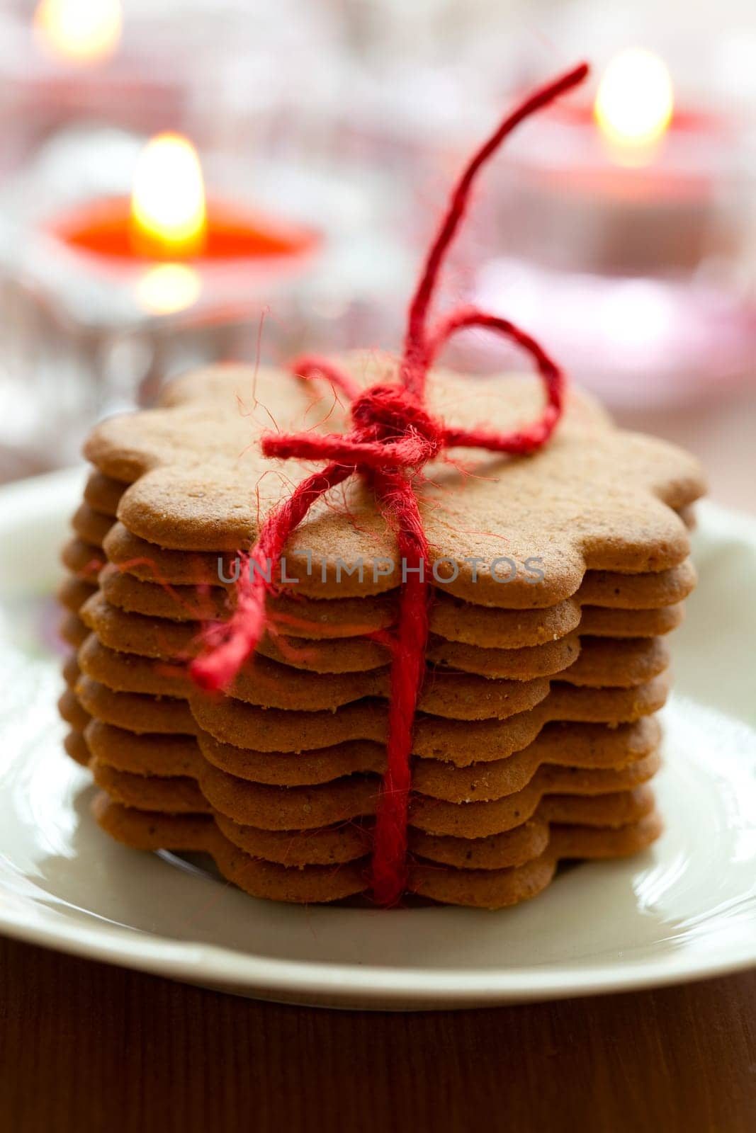 Close-up of delicious Christmas gingerbread cookies with candles
