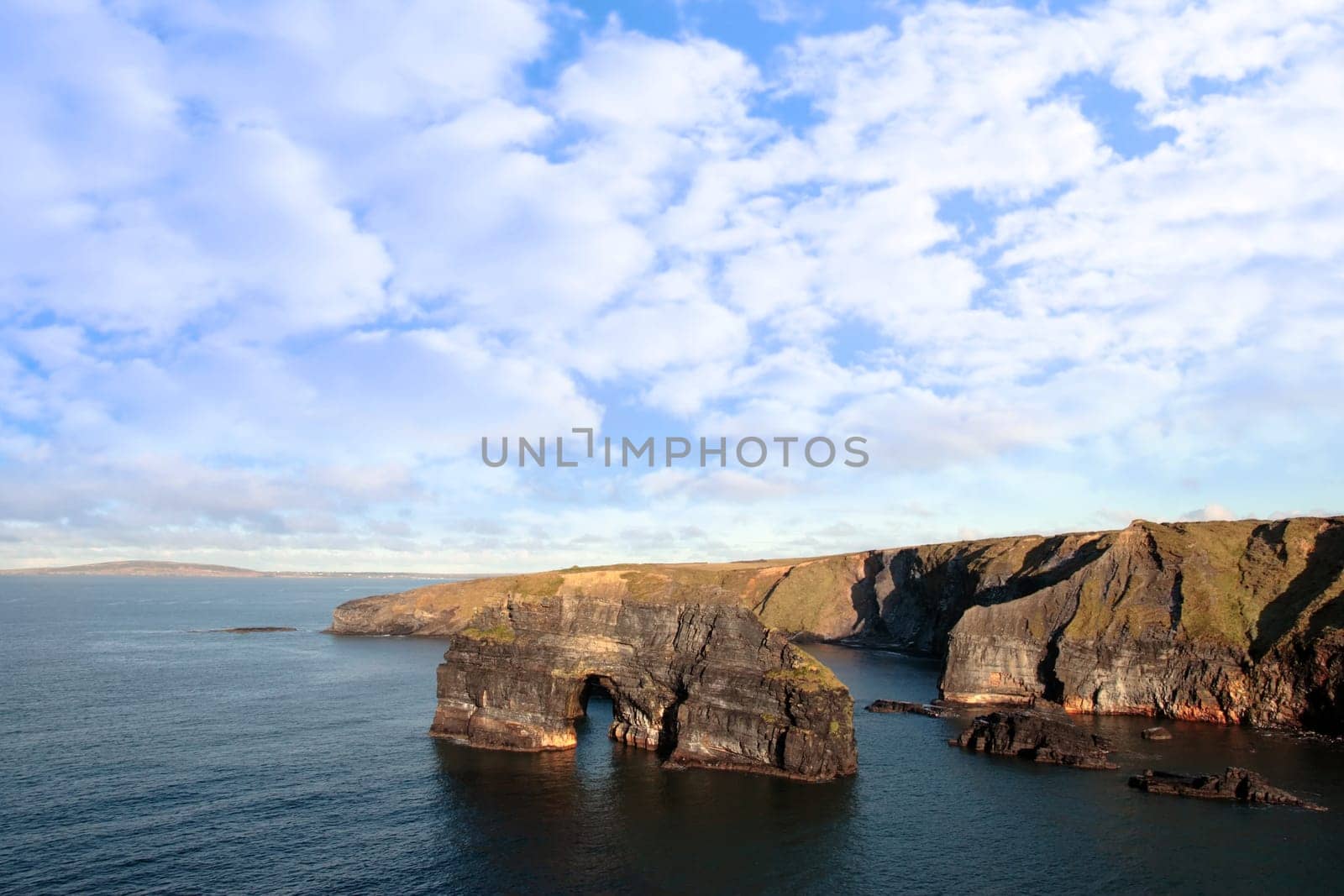 a view of the virgin rock in ballybunion ireland as seen from the cliffs on a calm winters day