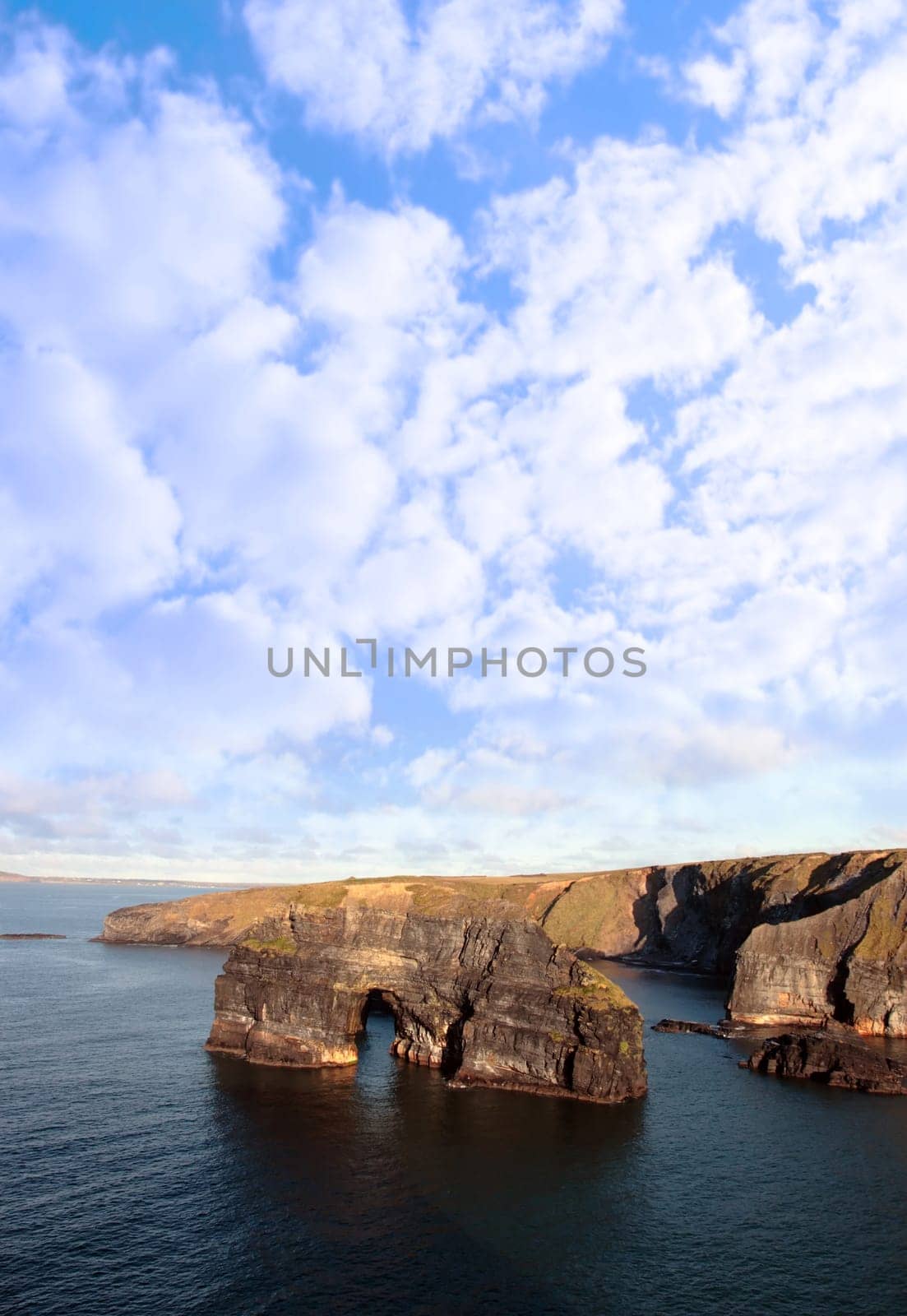 a view of the virgin rock in ballybunion ireland as seen from the cliffs on a calm winters day
