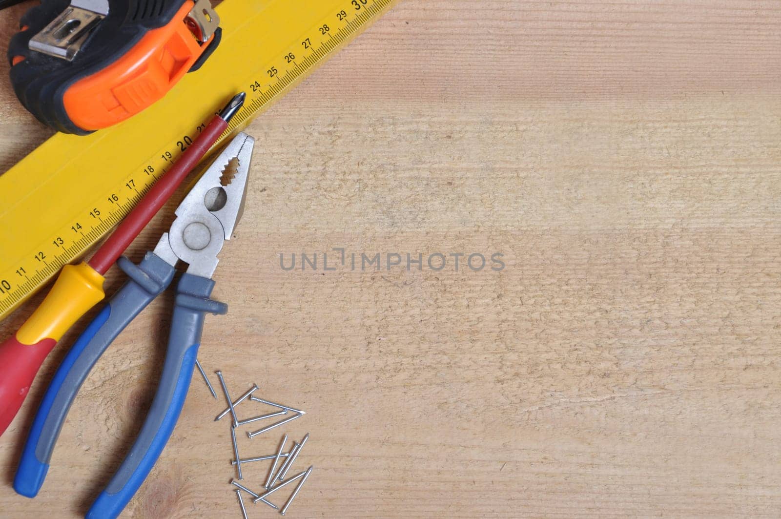 Complete of tools on a wooden background