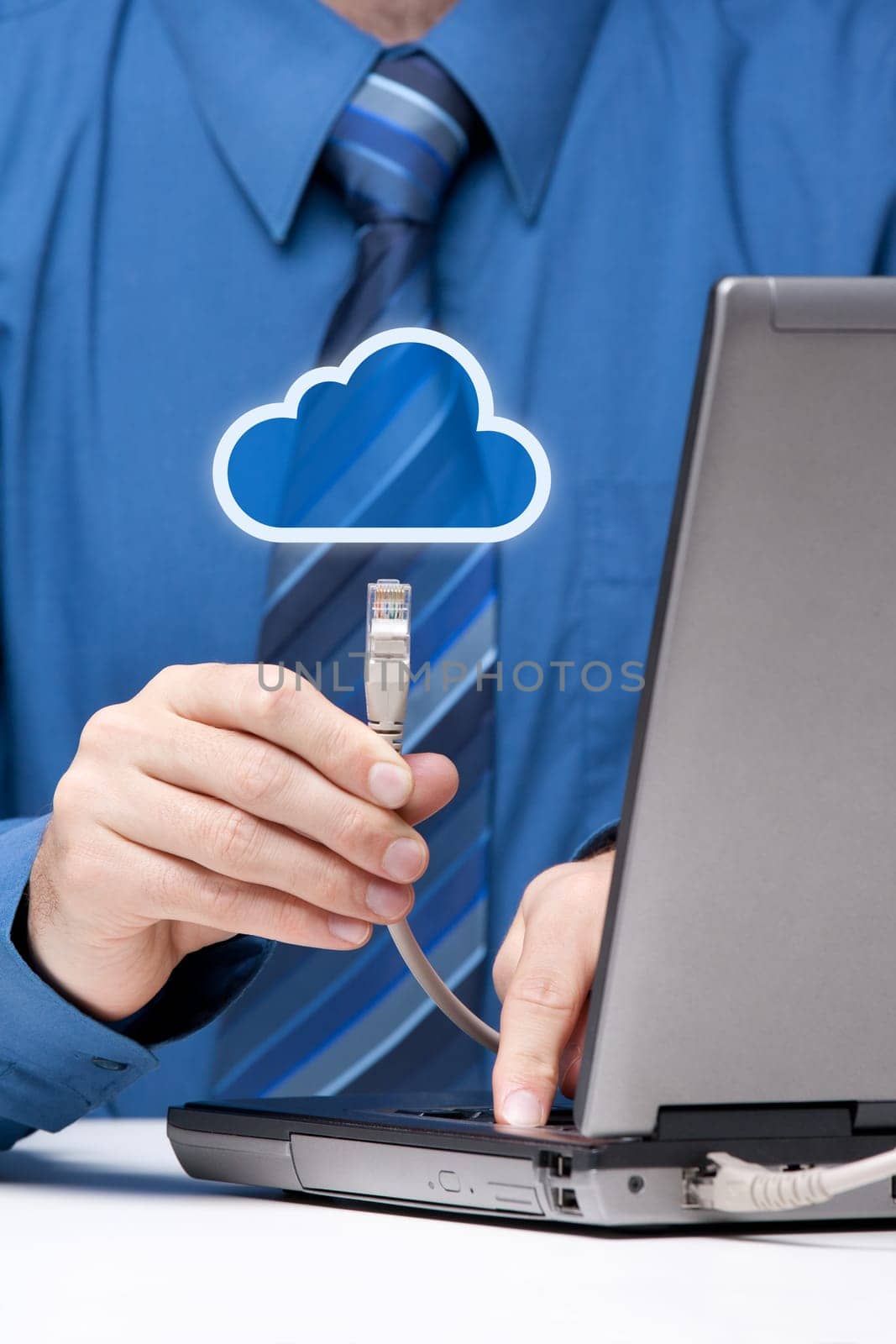 Cloud computing concept. Man send data from laptop to cloud represented by icon via ethernet cable. Selective focused on cable.