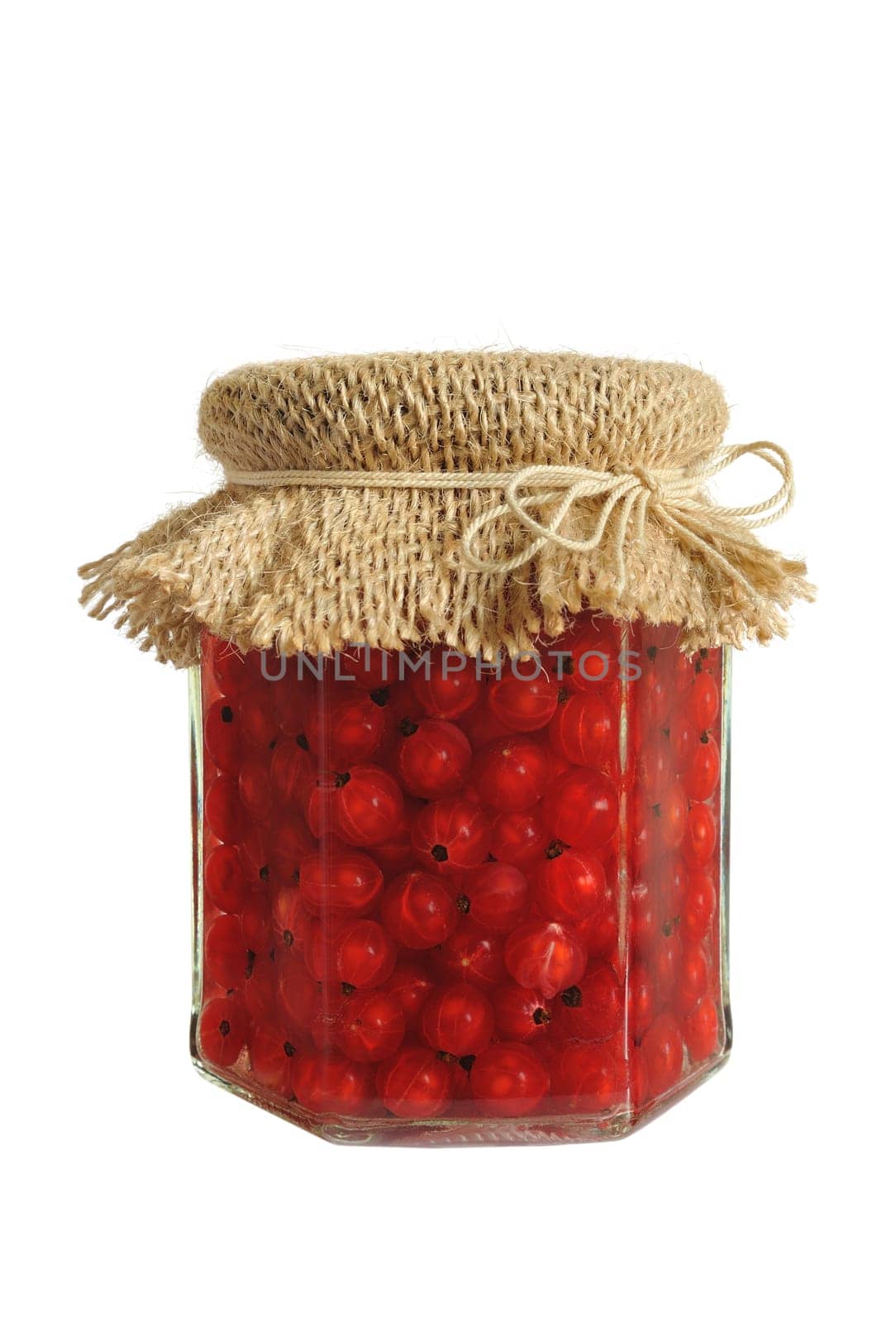 Canned red currant berries in jar - isolated