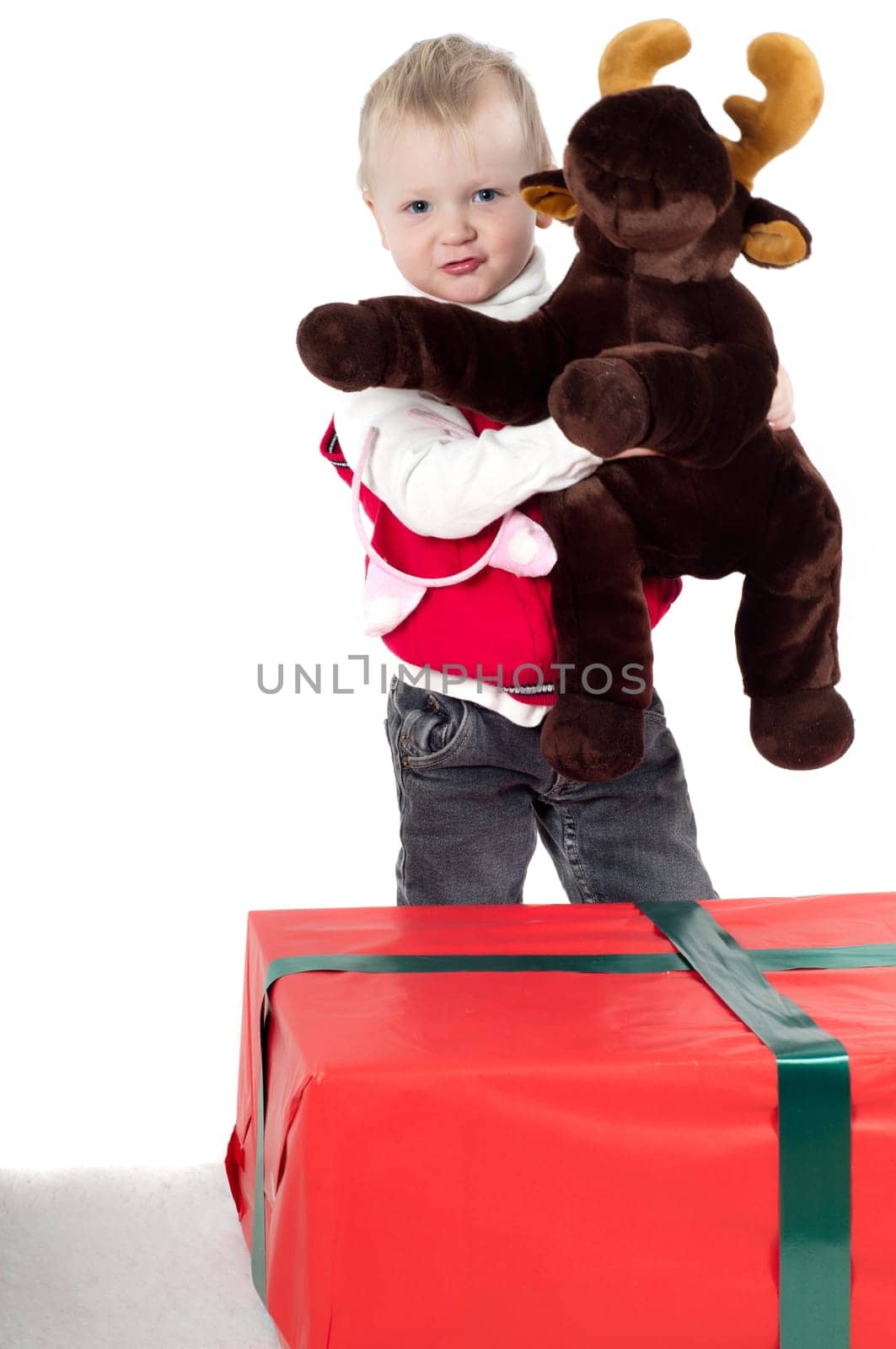 Shot of christmas toddler with presents isolated on white