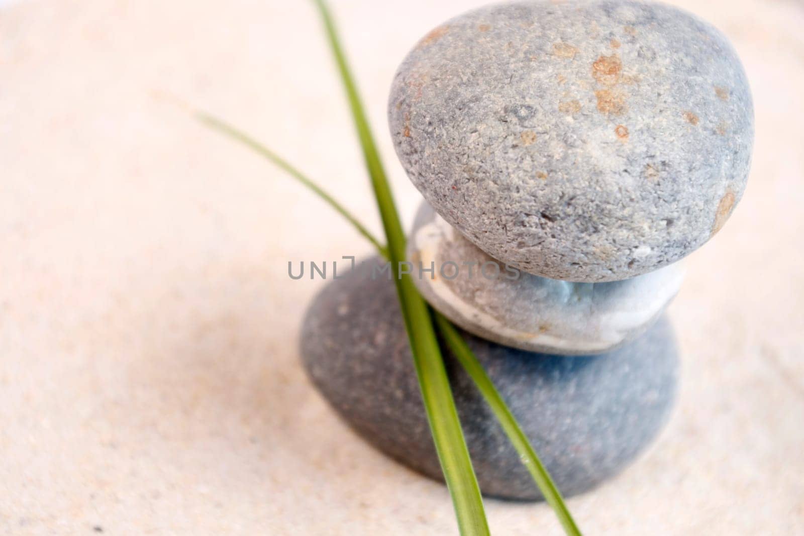 Stone tower with blade of grass