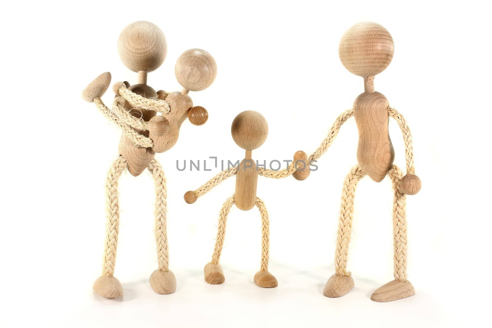a family of wooden dolls against a white background