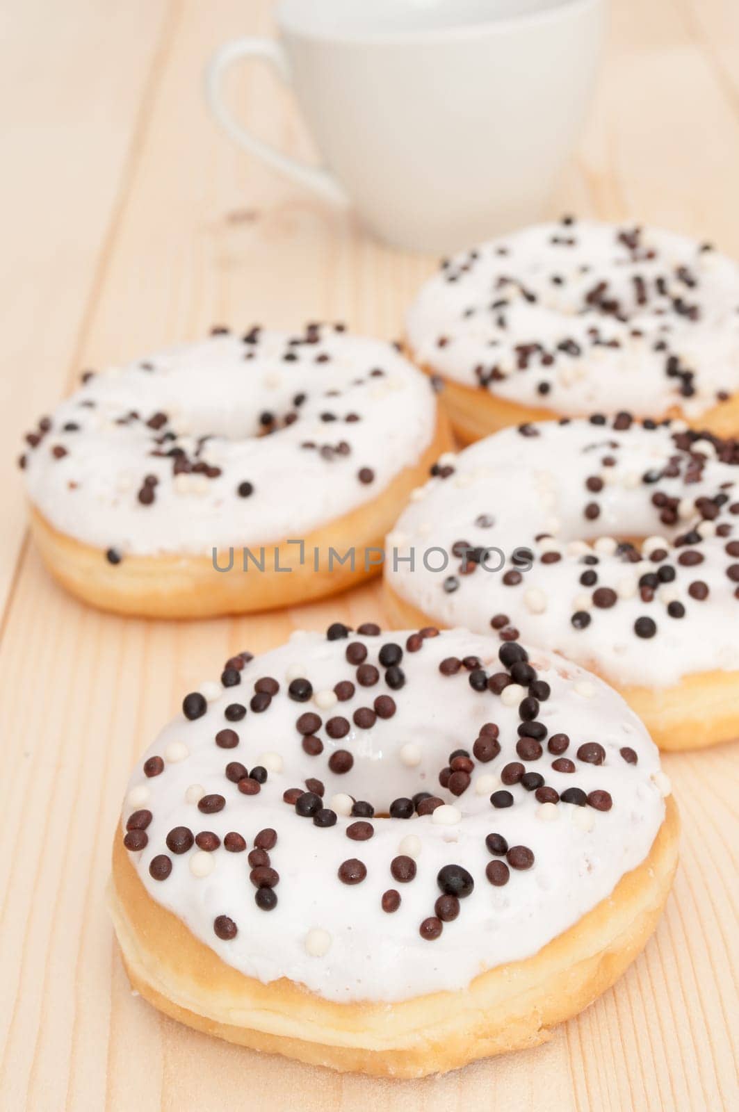 Breakfast - Donuts and White Cup on Wooden Table