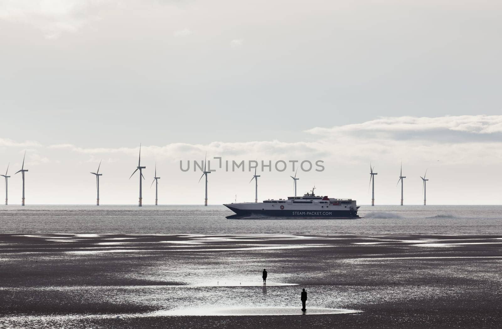CROSBY BEACH, ENGLAND - SEPTEMBER 24: Steam Packet ferry sails into Liverpool on September 24, 2011. The 96-metre wave piercing catamaran is the largest vessel of its kind in the Irish Sea.