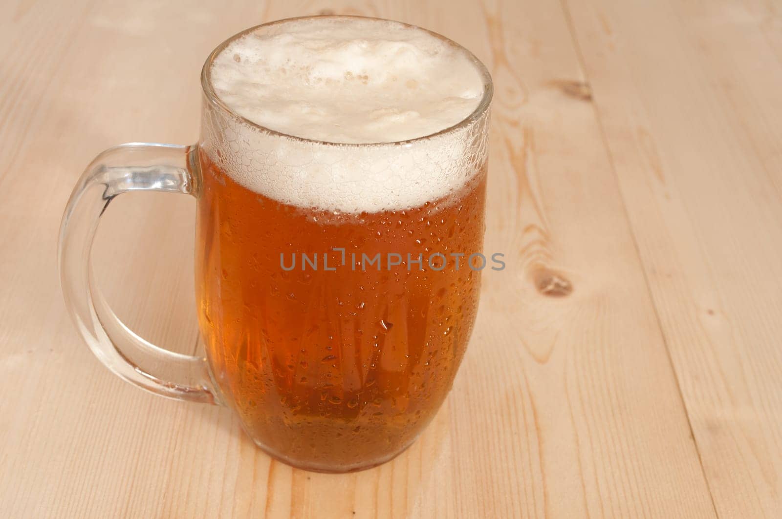 Glass Full of Beer on Wooden Table