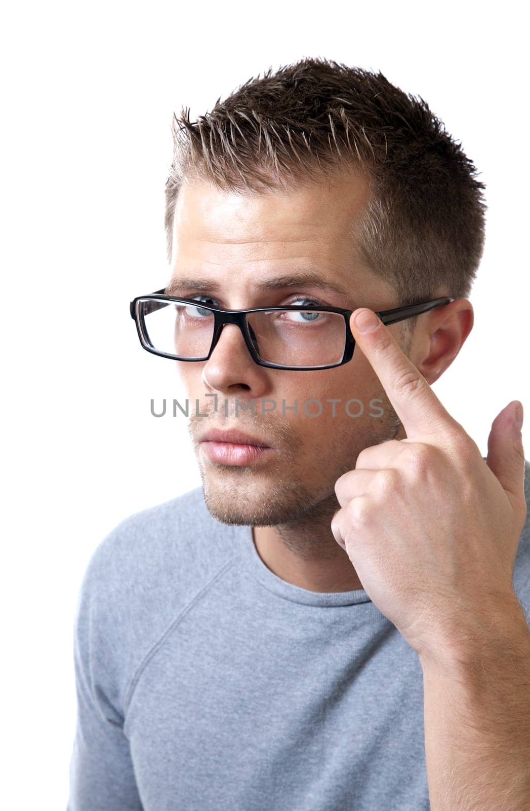 Young man pointing at his glasses