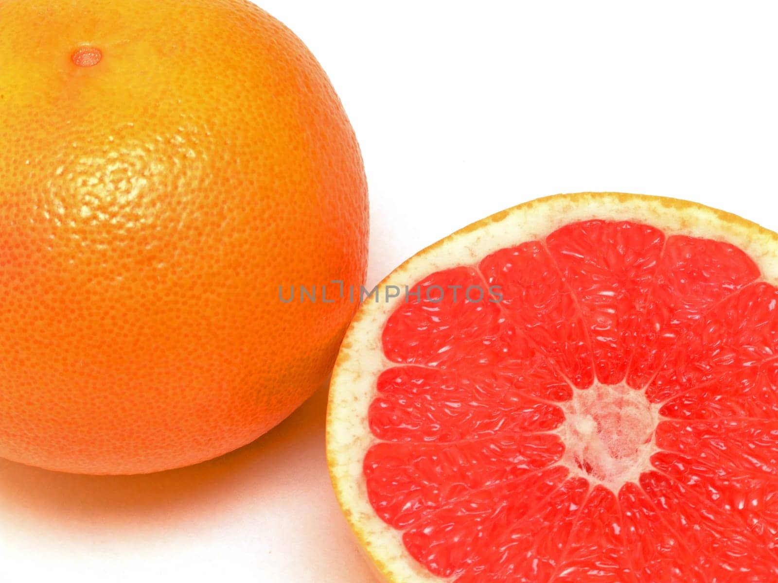 a grapefruit with spoon