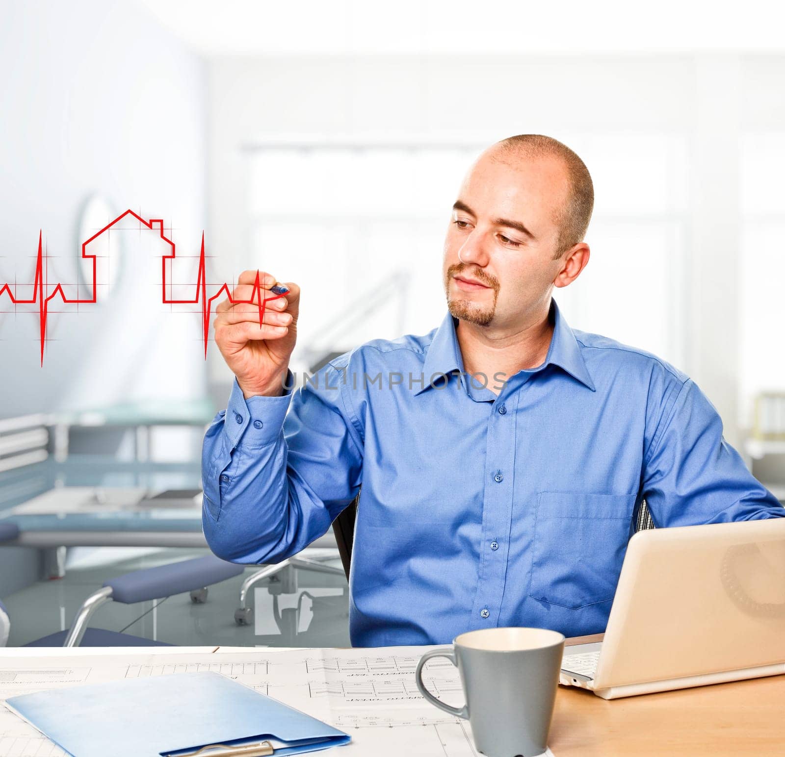 man in office drawing house metaphore