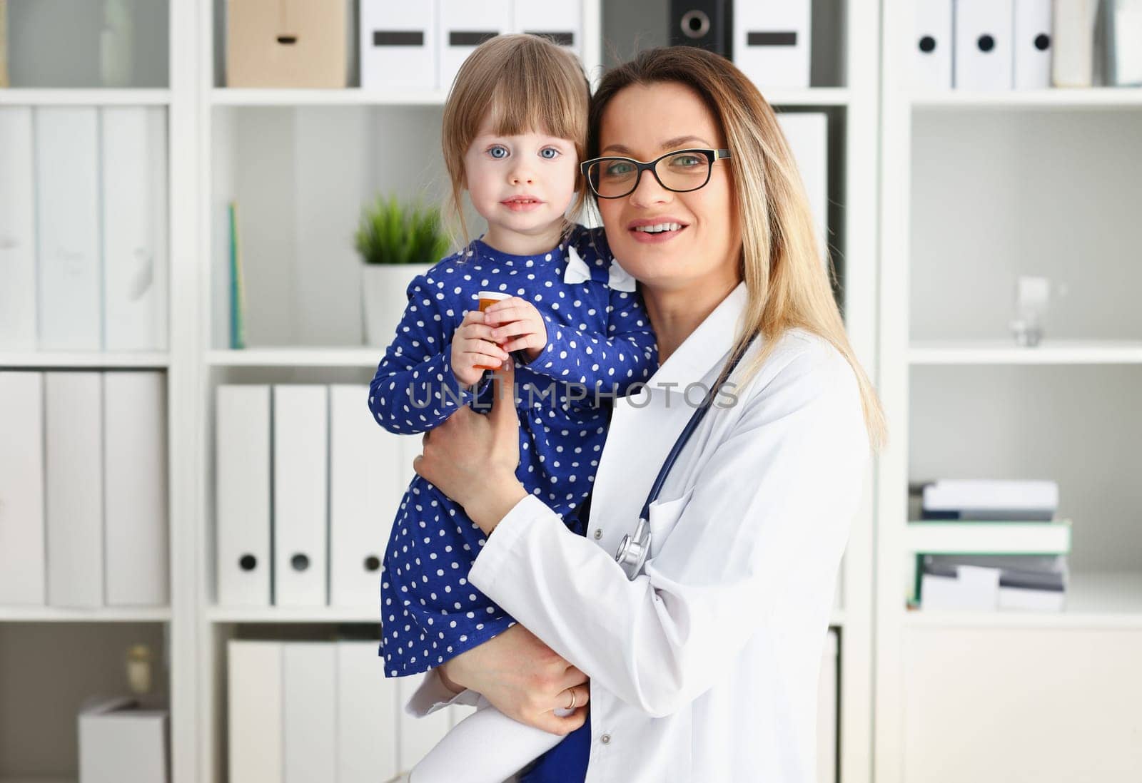 Little child with mother at pediatrician reception by kuprevich