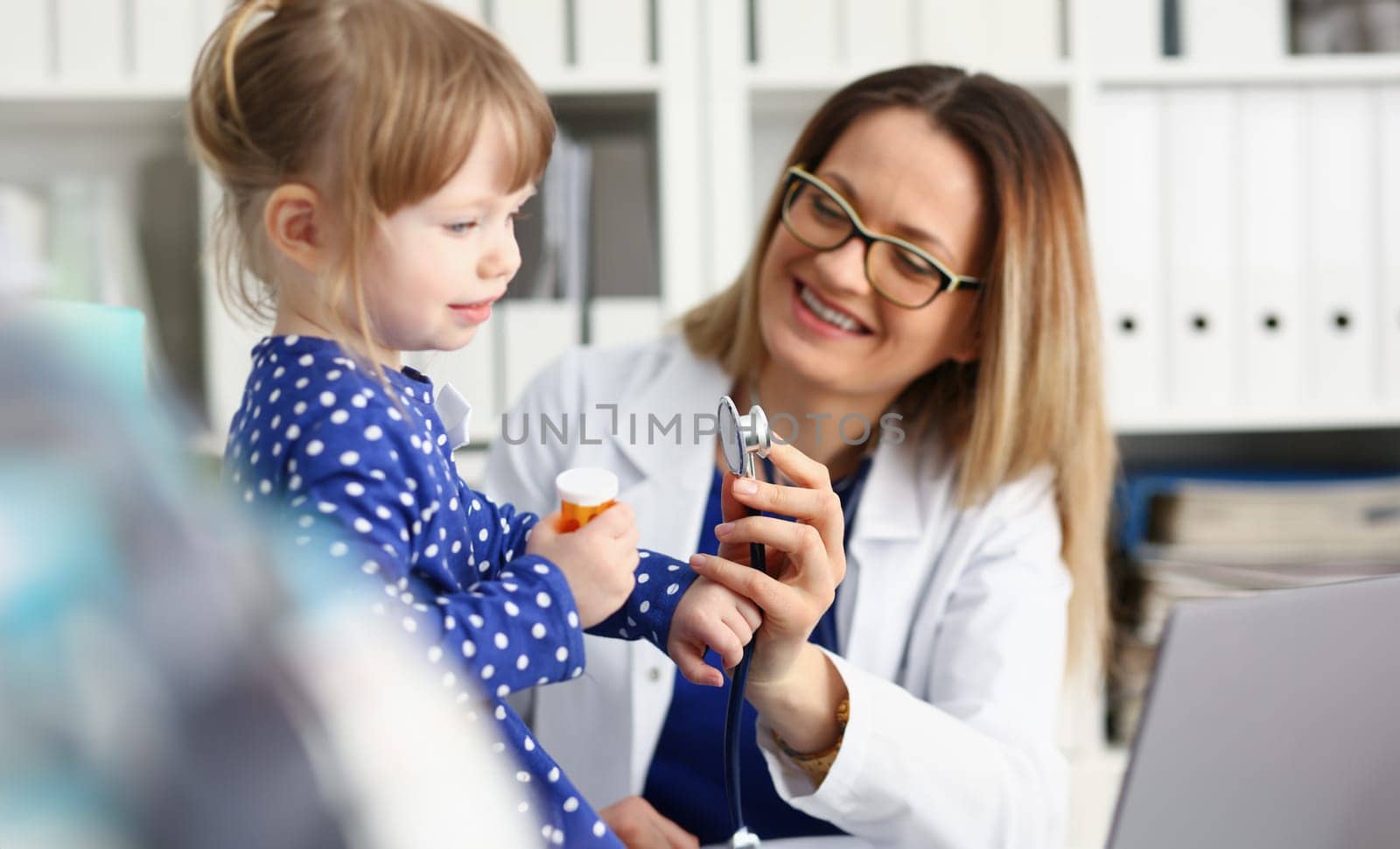 Little child with stethoscope at doctor reception. Physical exam cute infant portrait baby aid healthy lifestyle ward round child sickness specialist clinic test pulse concept