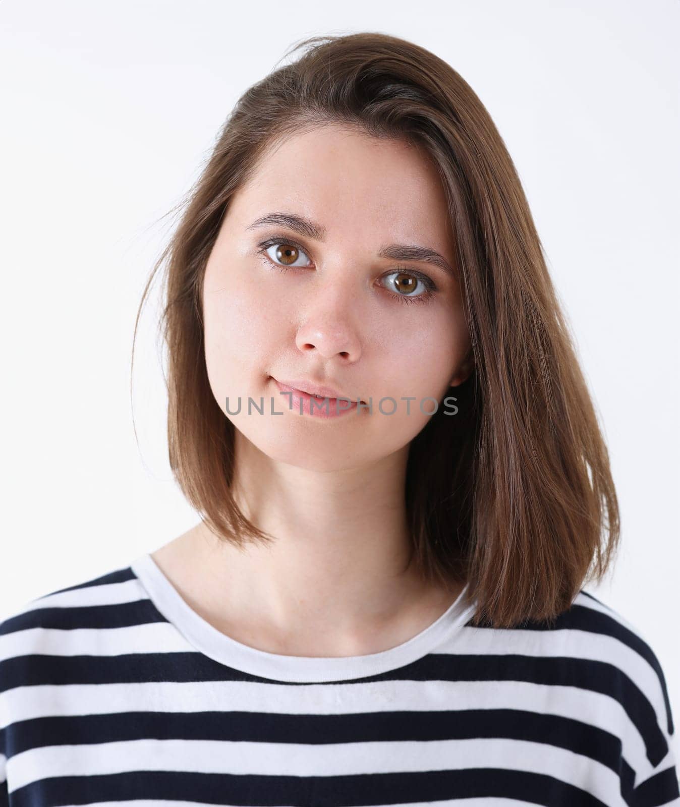 Fashion model woman face large portrait on a gray background