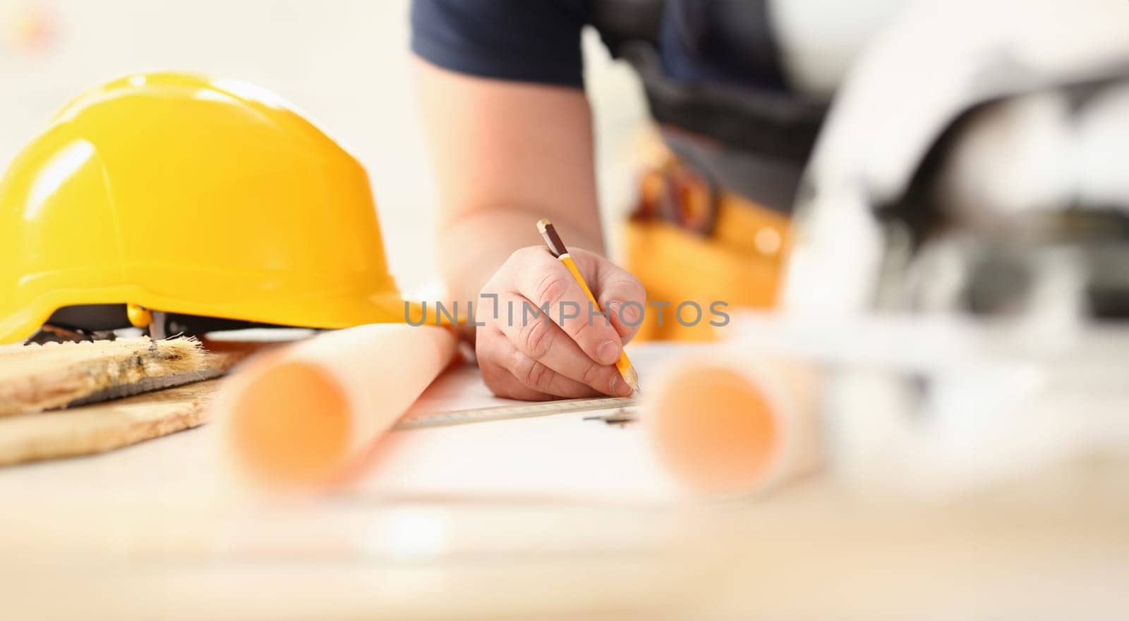 Arms of worker making structure plan on scaled paper closeup. Manual job DIY inspiration improvement job fix shop graphic joinery startup workplace idea designer career industrial education